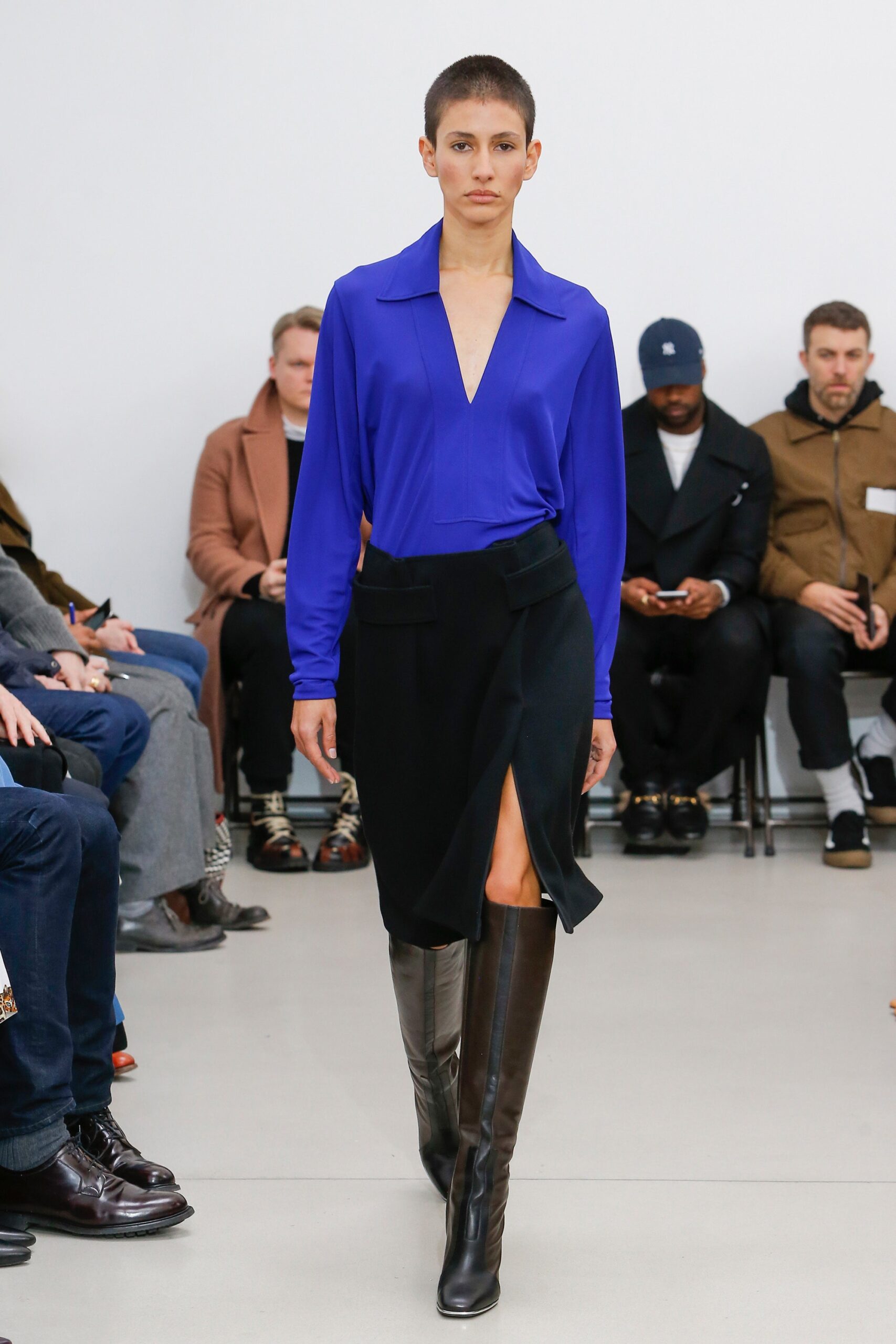blue silk fitted shirt with black skirt