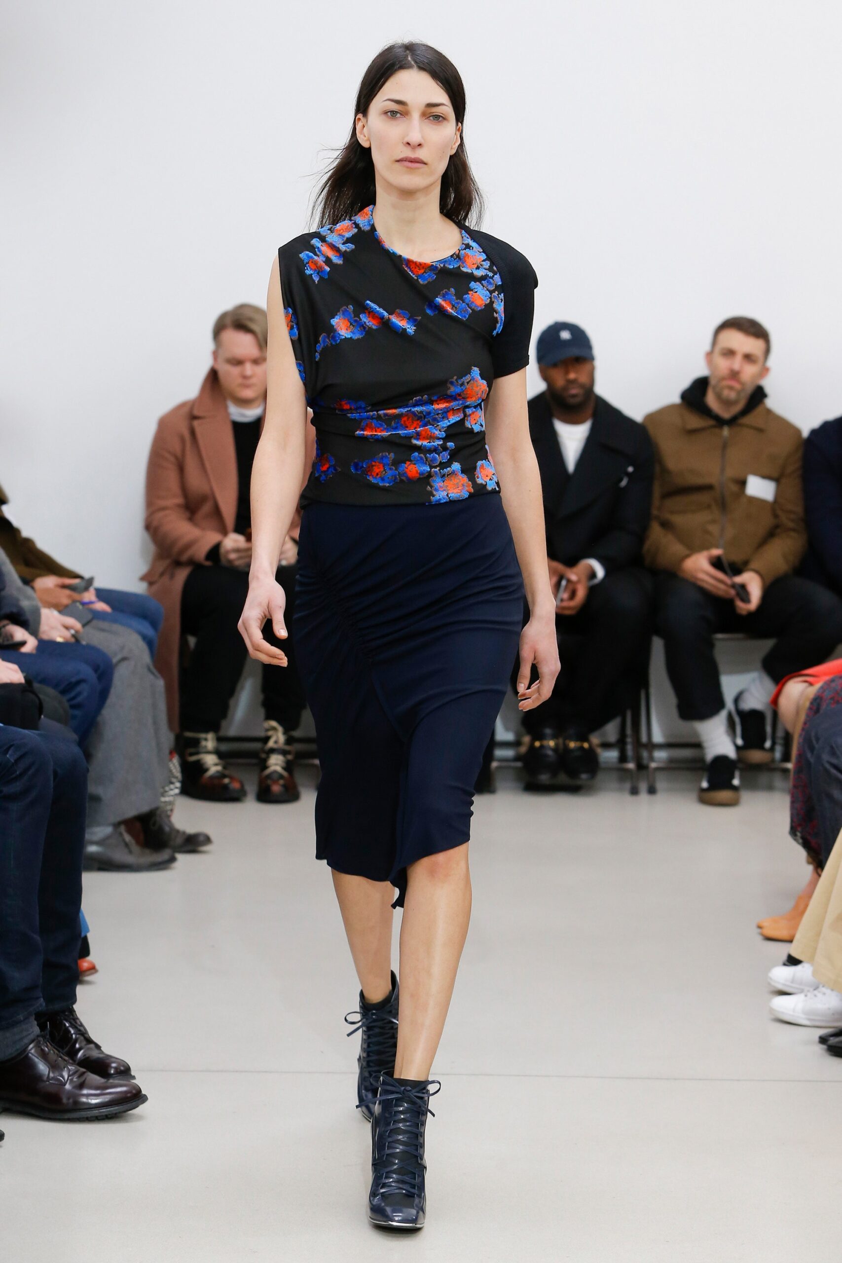 black embroidered top with navy skirt