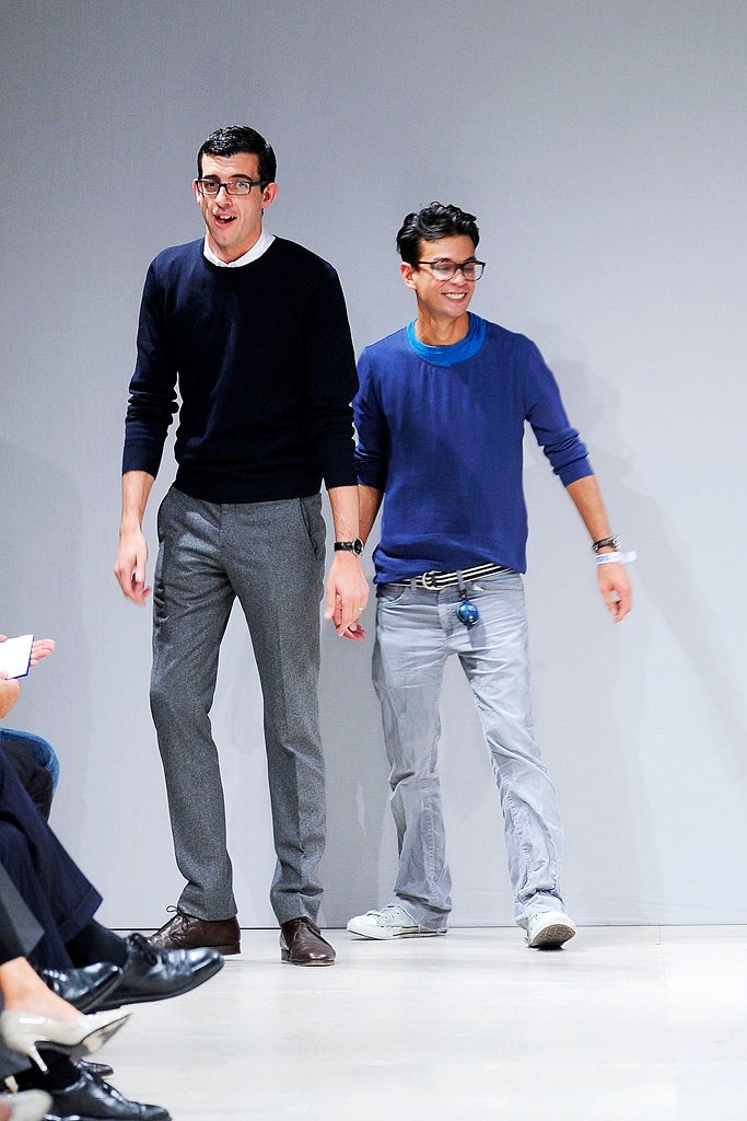 navy sweater and gray tailored pants