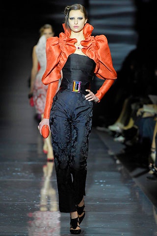 black silk fitted jumpsuit with red cape