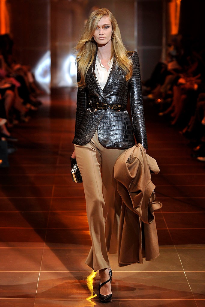 black leather tailored blazer with beige pants