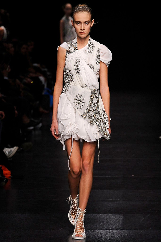 white ruffled mini dress with lace-up shoes