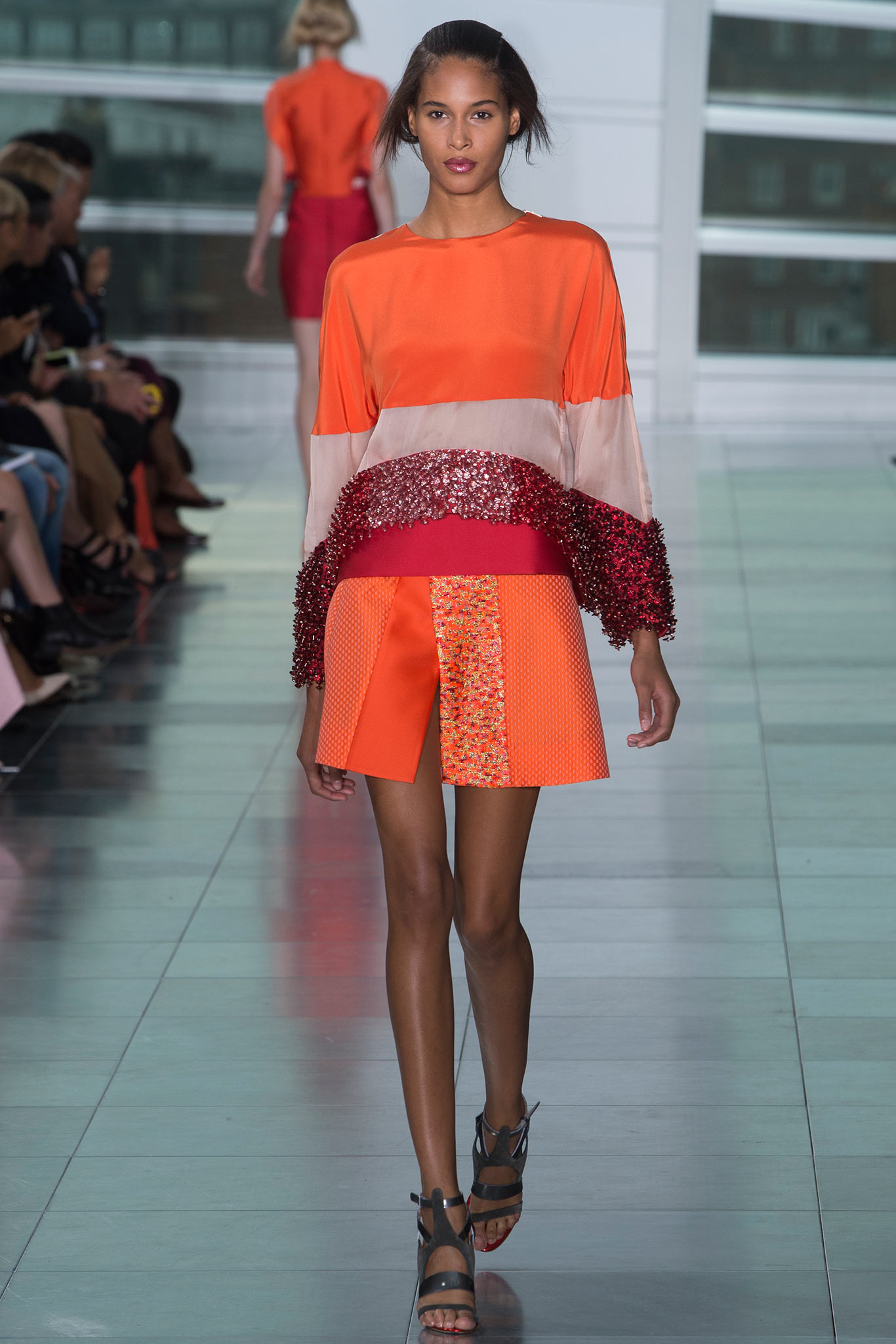 colorful layered top and pleated skirt
