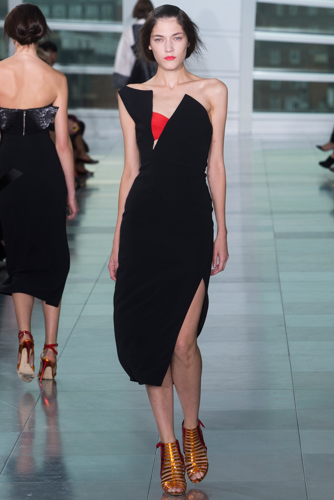 black silk asymmetric dress with strappy shoes