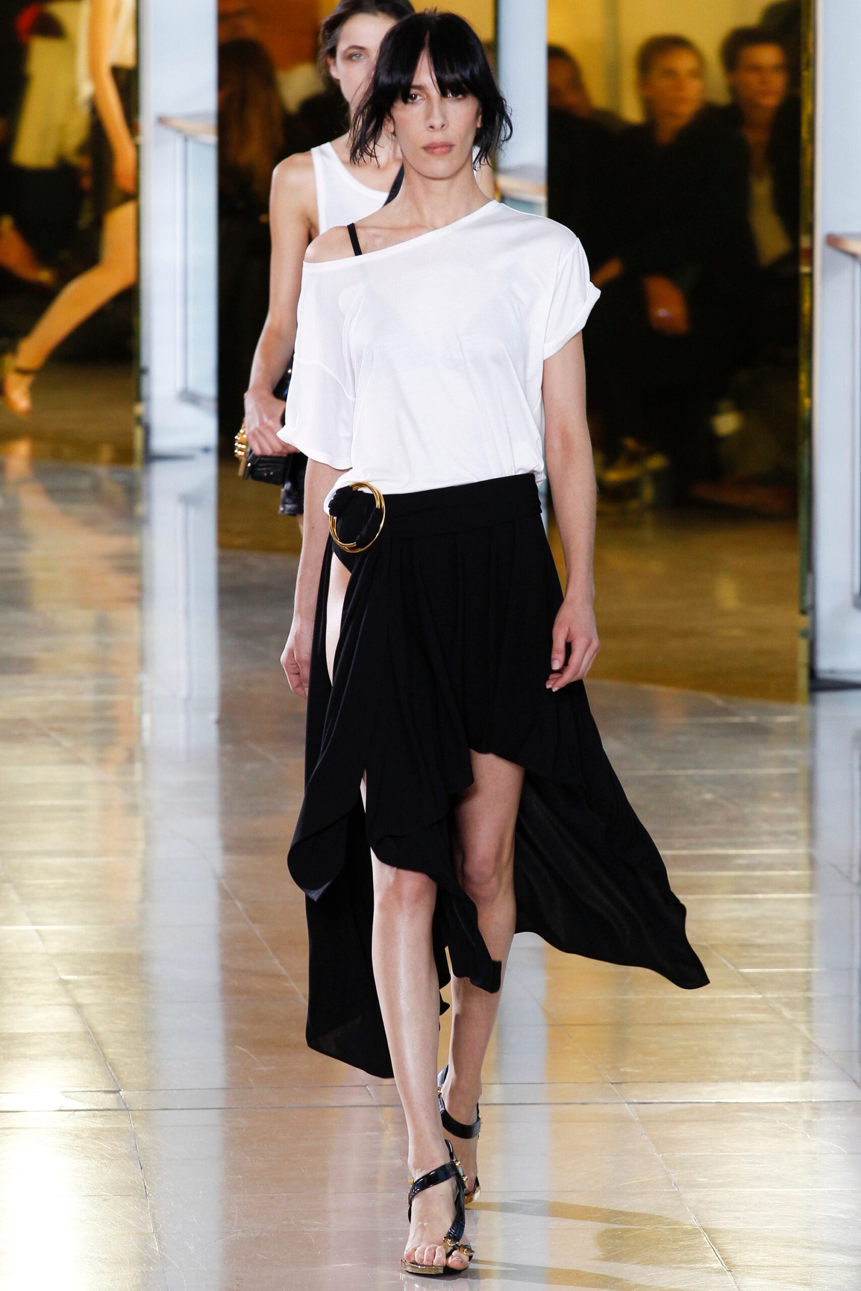 white off-shoulder top and black asymmetric skirt