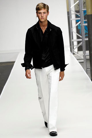 black fitted jacket and white tailored pants