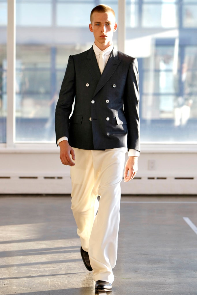 black tailored blazer and white pants