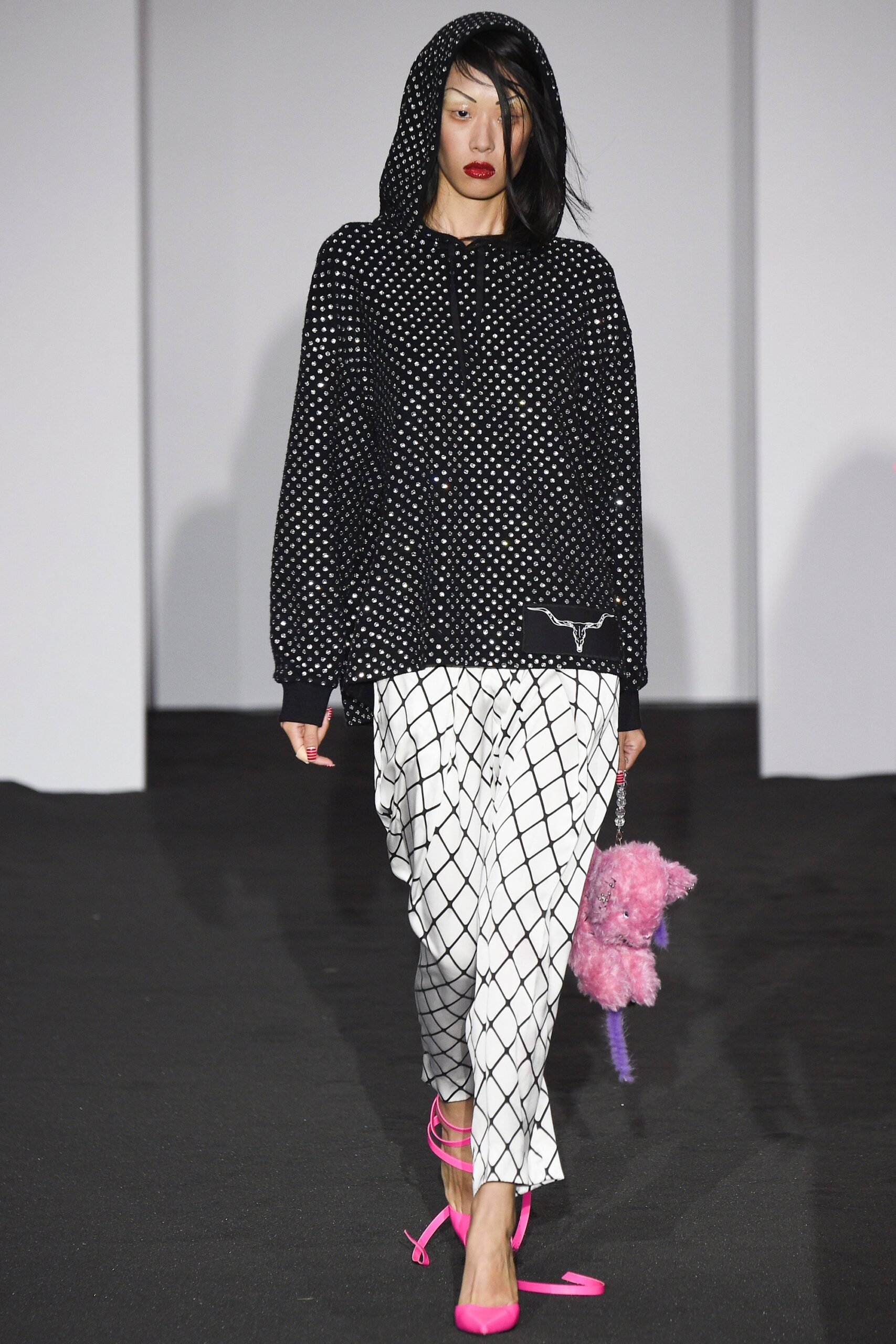 black polka-dot hoodie with checked pants