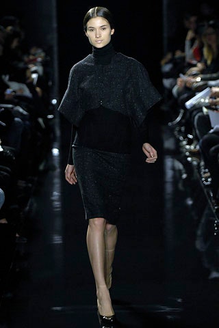 black fitted dress with cape