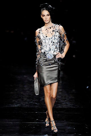 white embroidered top with black leather skirt