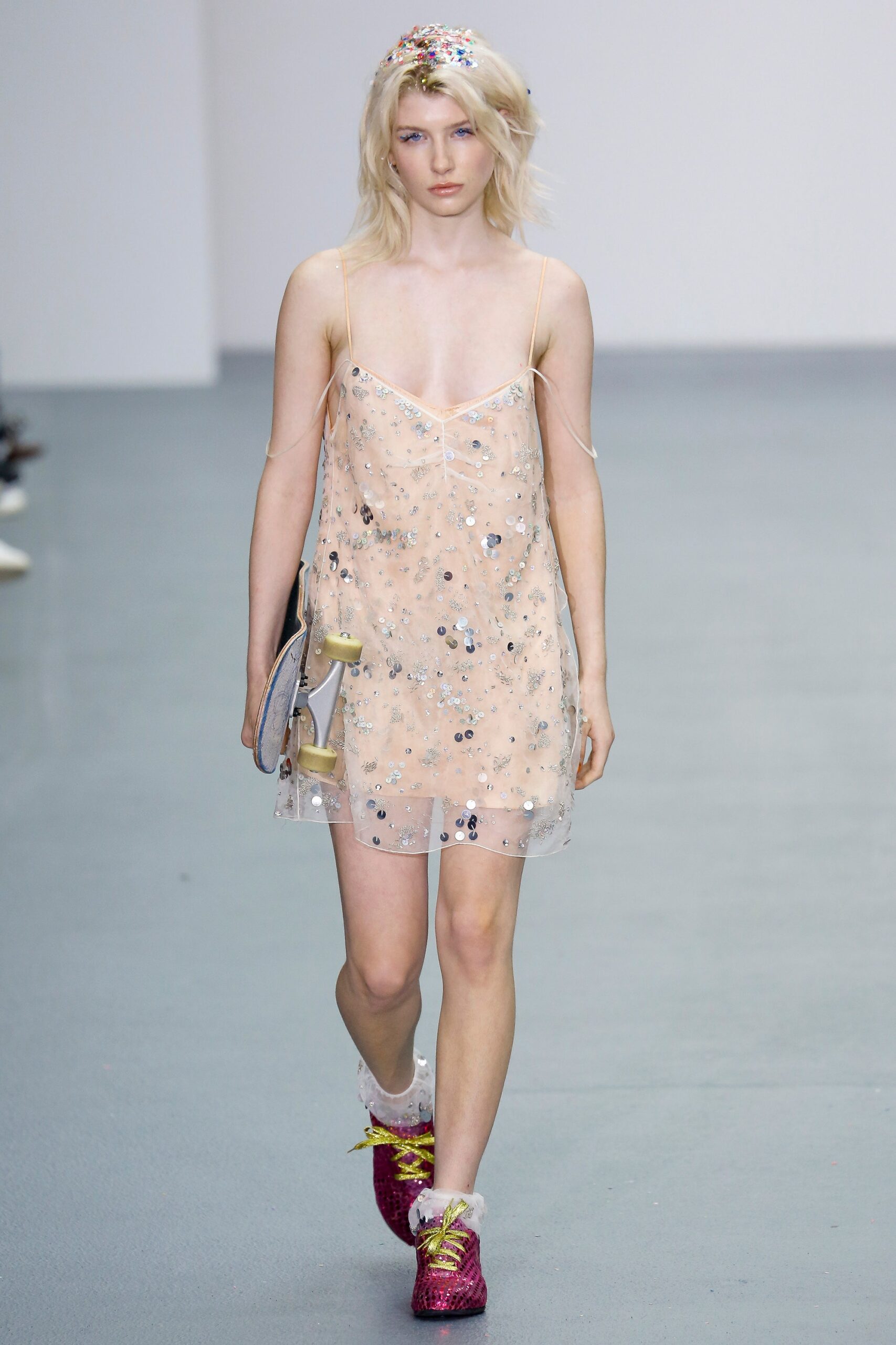 peach sequined mini dress with pink shoes