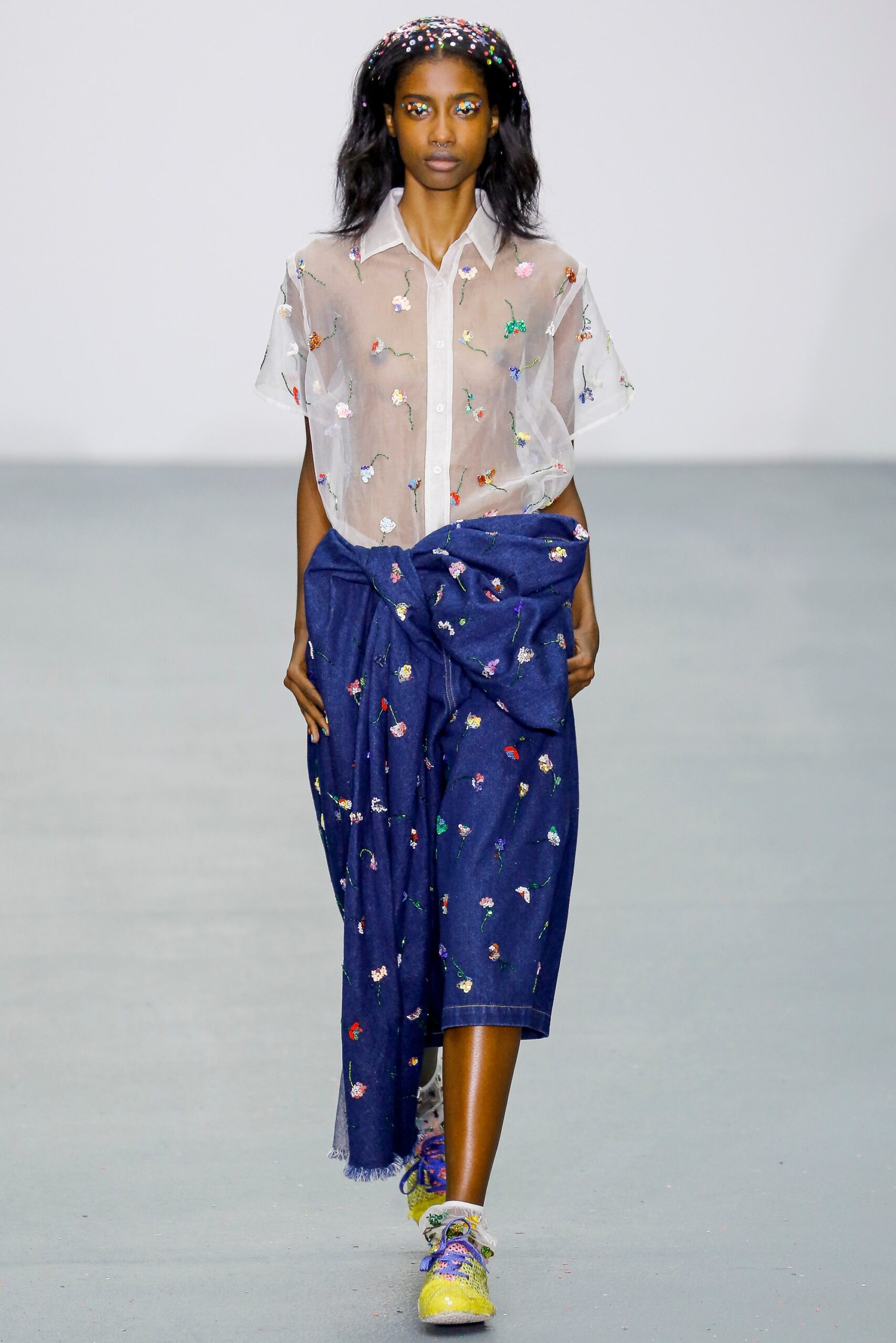 white embroidered shirt and blue skirt