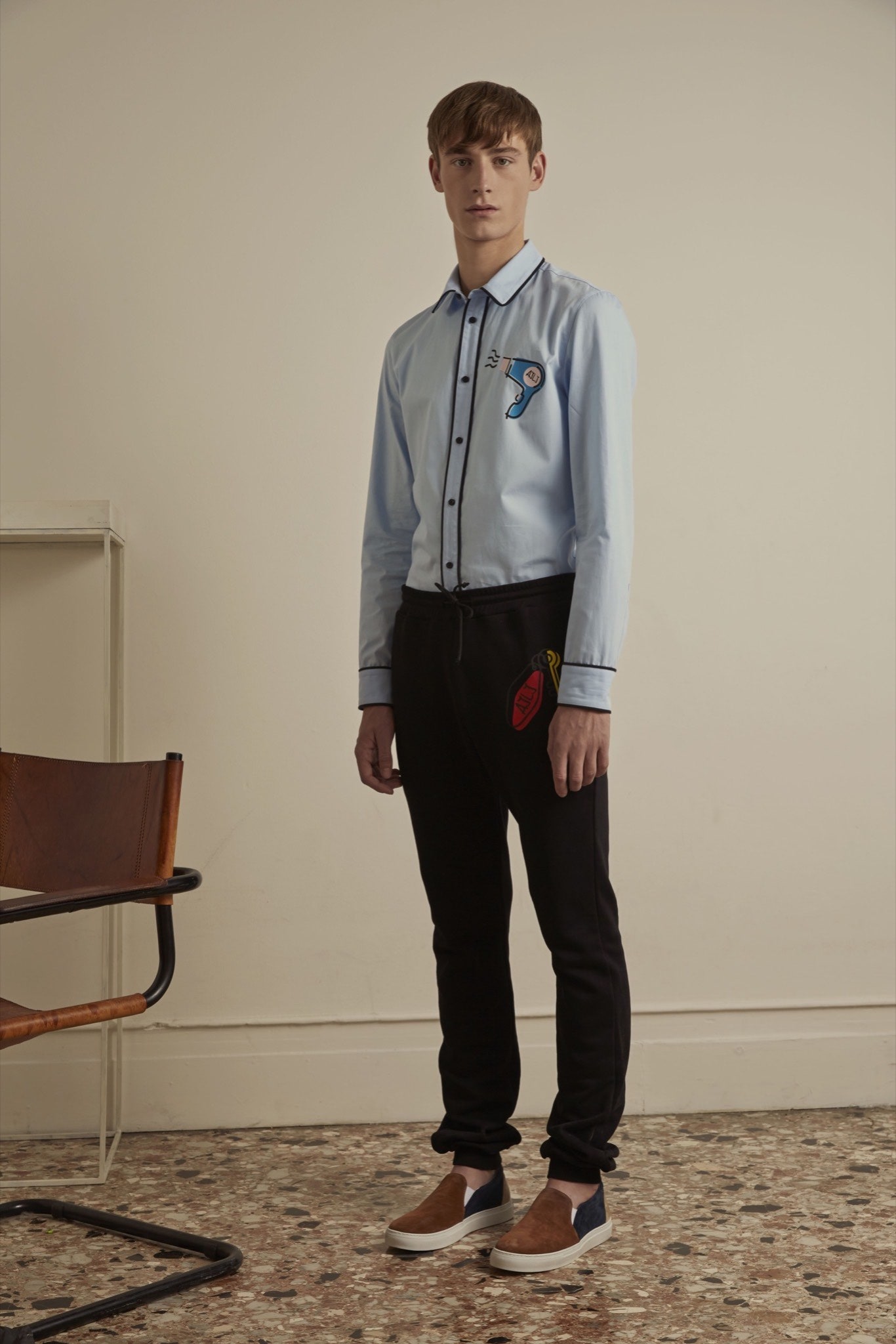 blue fitted shirt with black pants