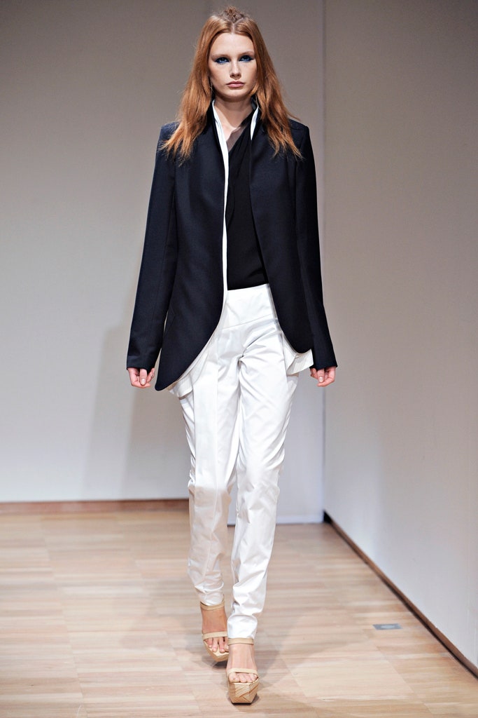 black tailored blazer and white pants