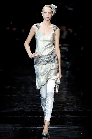 silver embellished sleeveless top with white pants