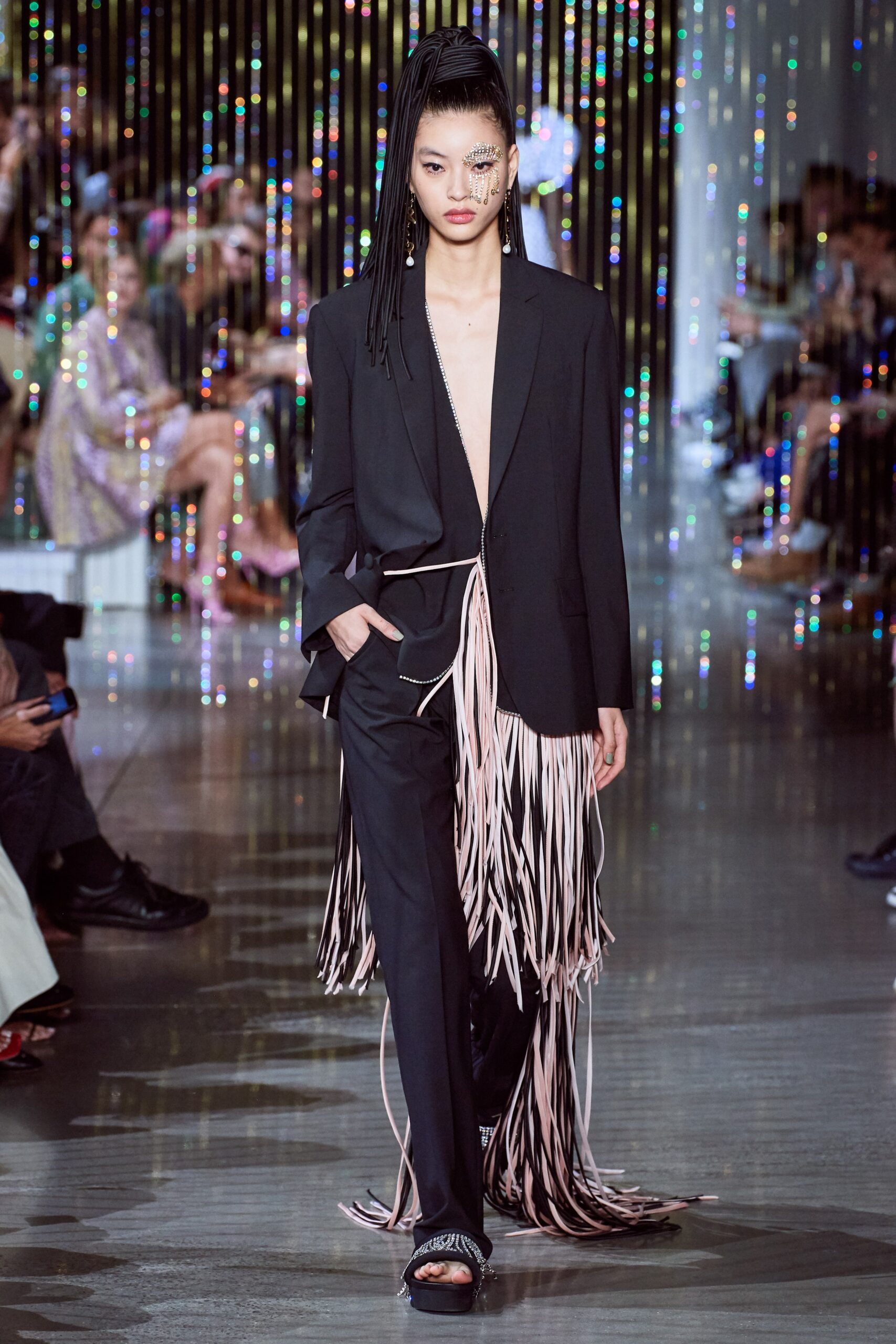 black fitted blazer and fringed pants