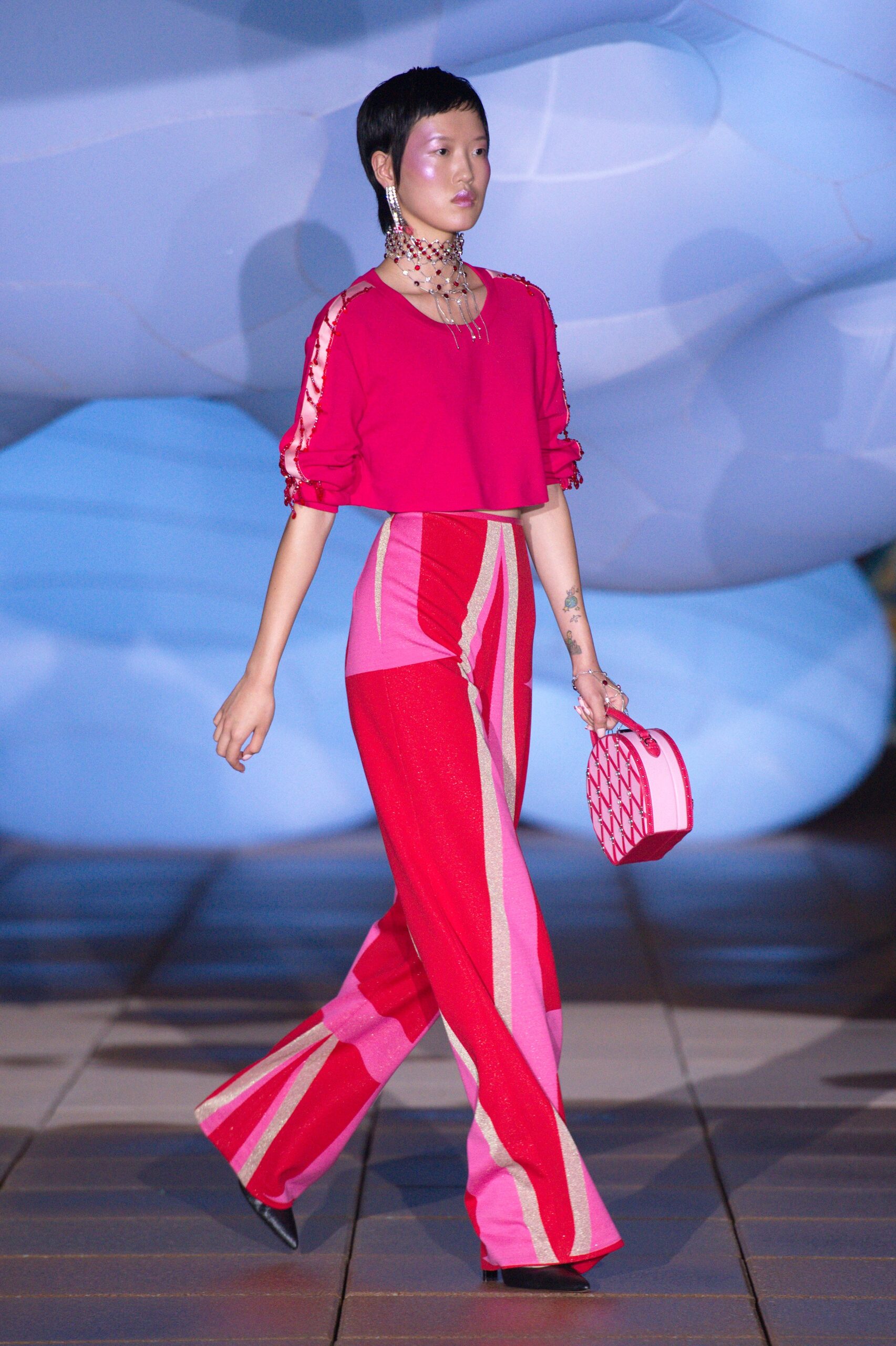 pink fitted top with flared pants