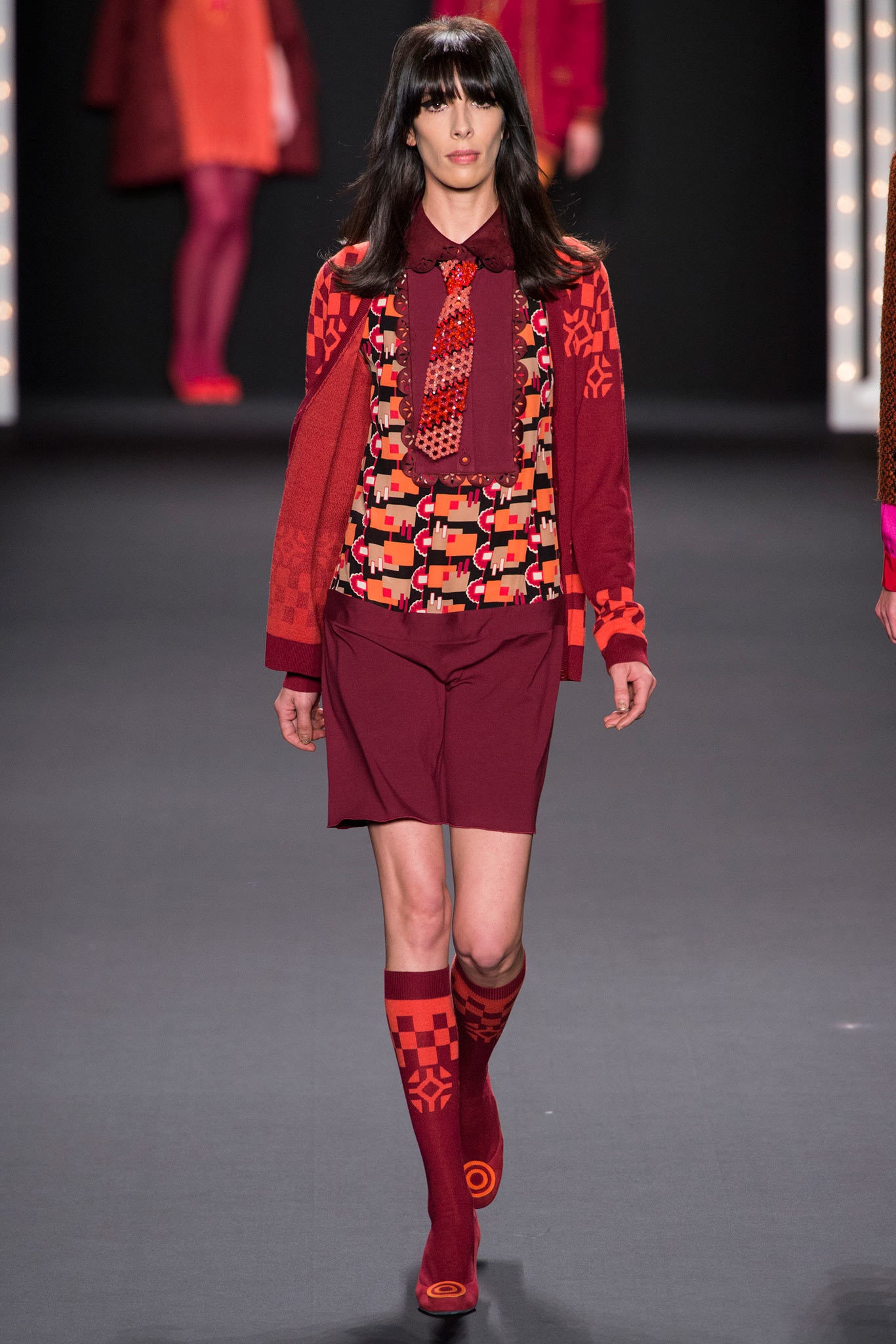 multi-patterned blouse with red jacket