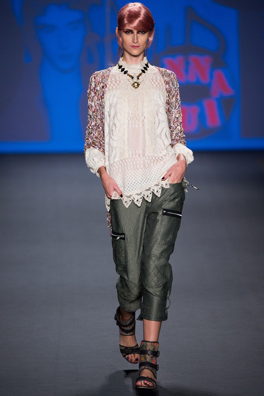 white embroidered blouse with green pants
