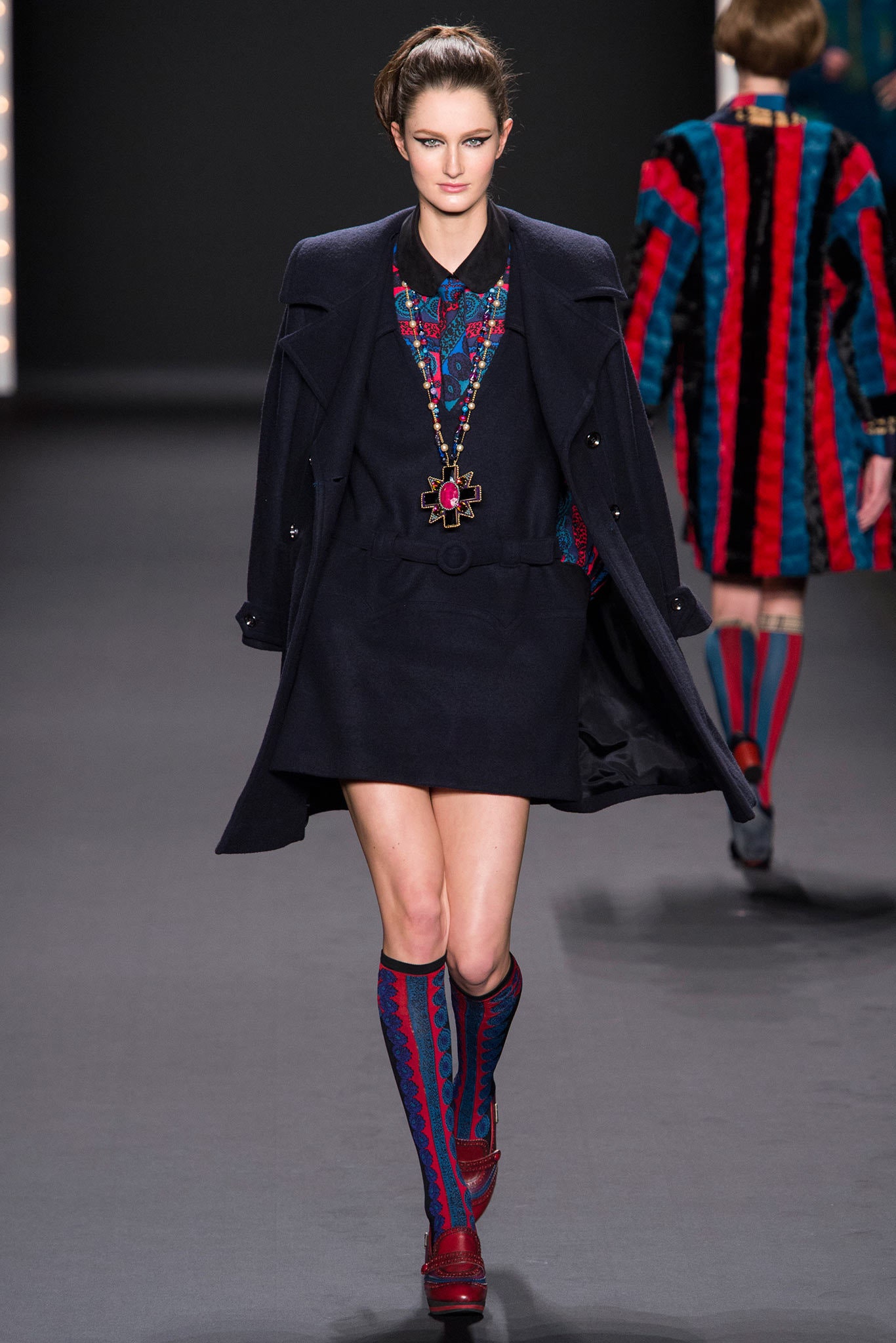 black wool long-sleeve collared structured buttoned coat
