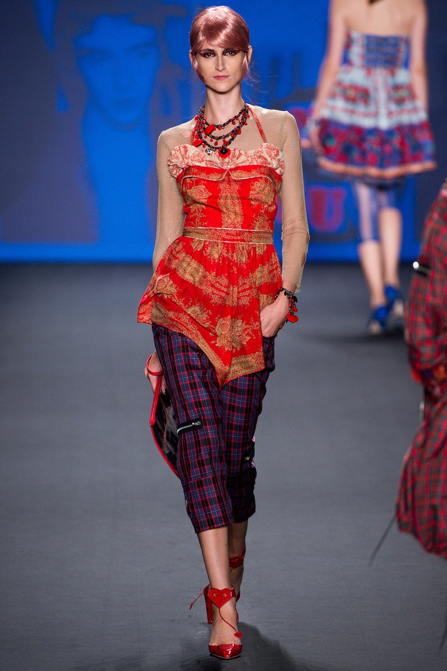 red silk ruffled top with plaid pants