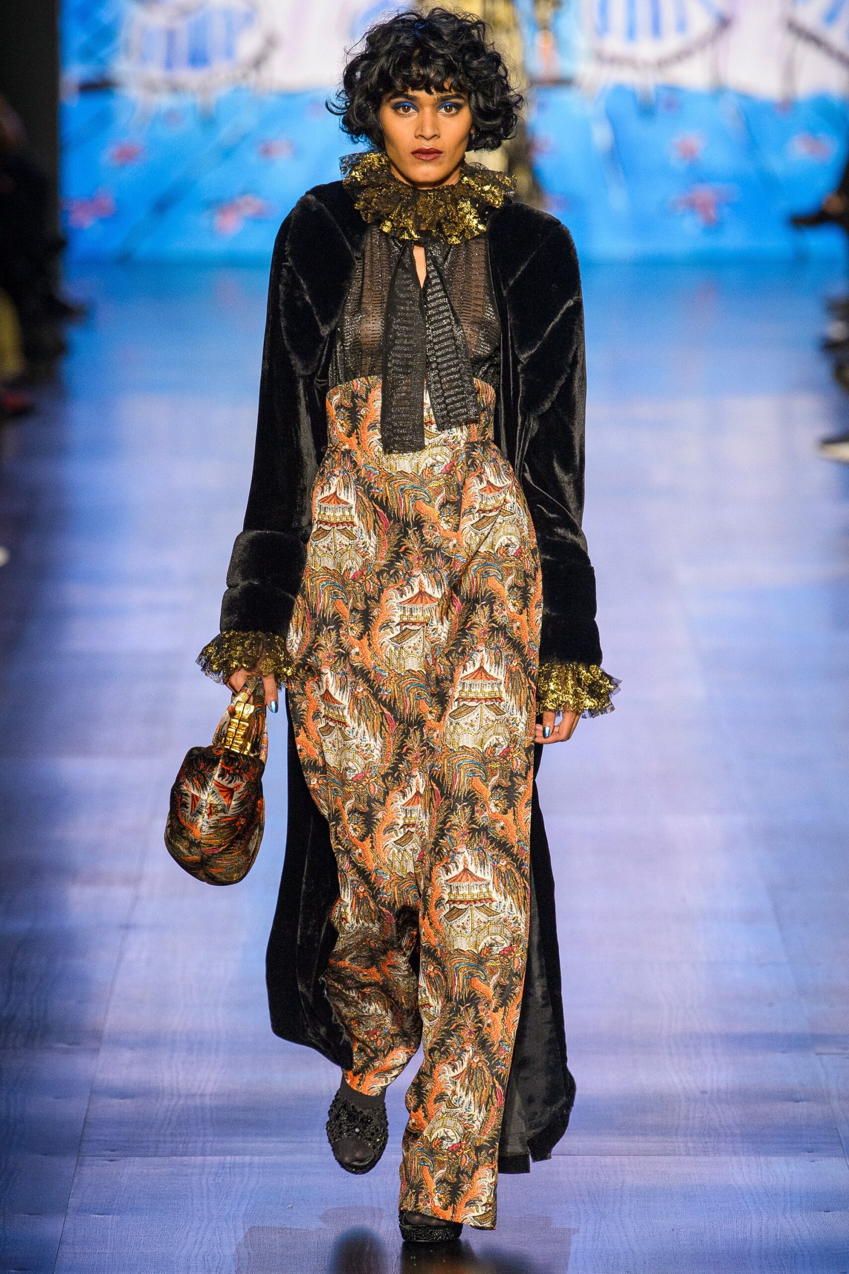 black velvet coat and multi jumpsuit