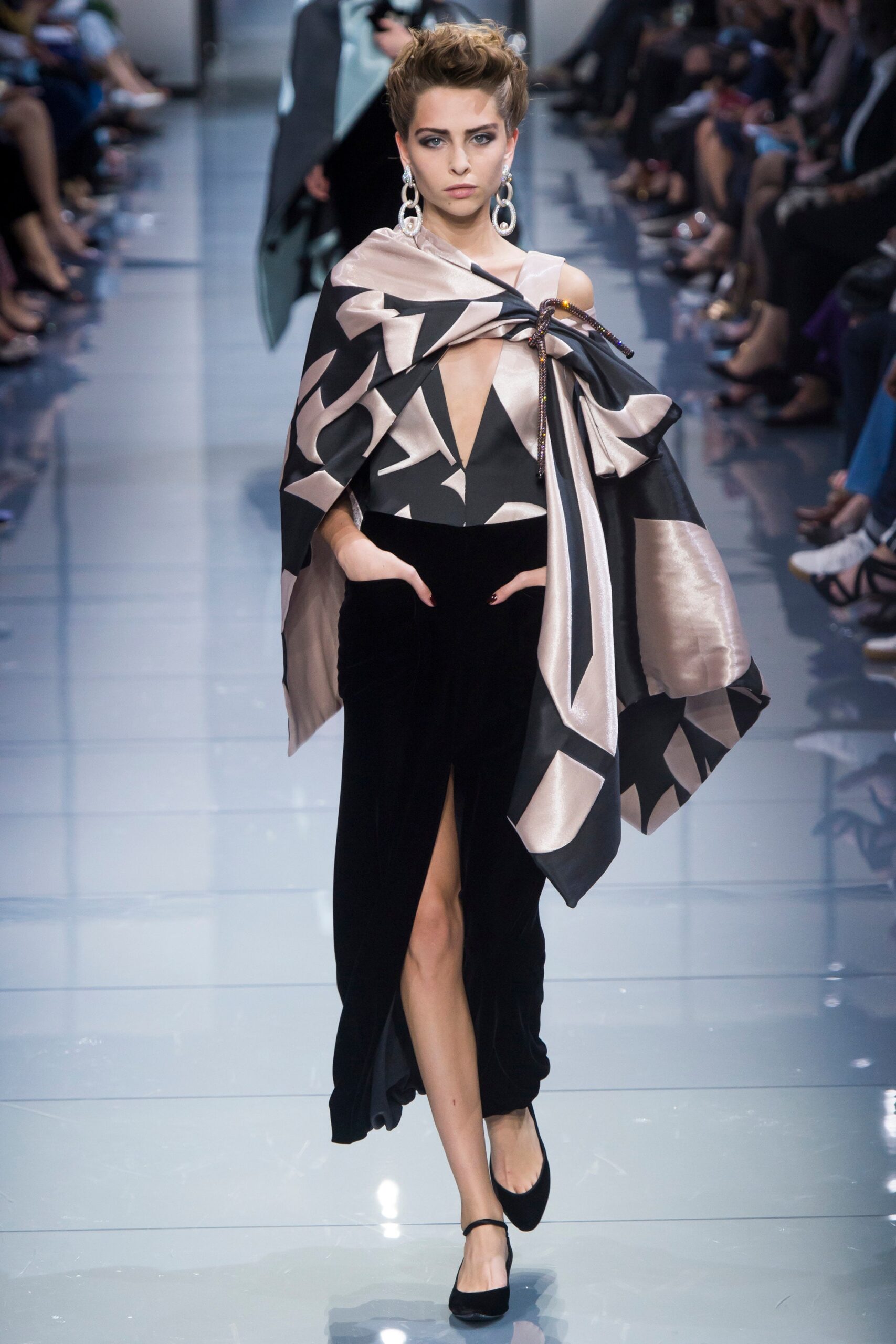 black and beige draped gown with cape