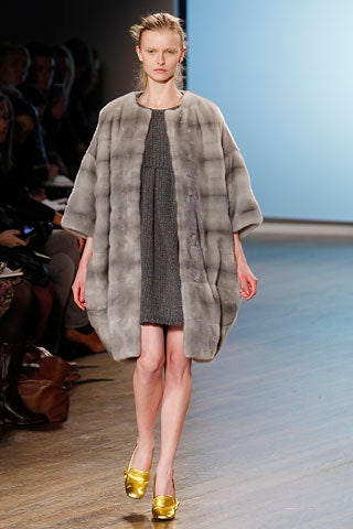gray fur coat with fitted dress