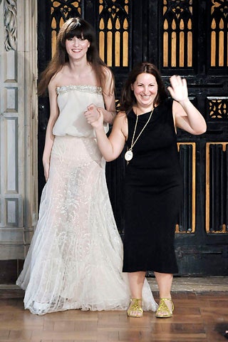 white lace sleeveless v-neck fitted layered flowing gown
