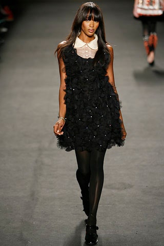 black ruffled sleeveless dress