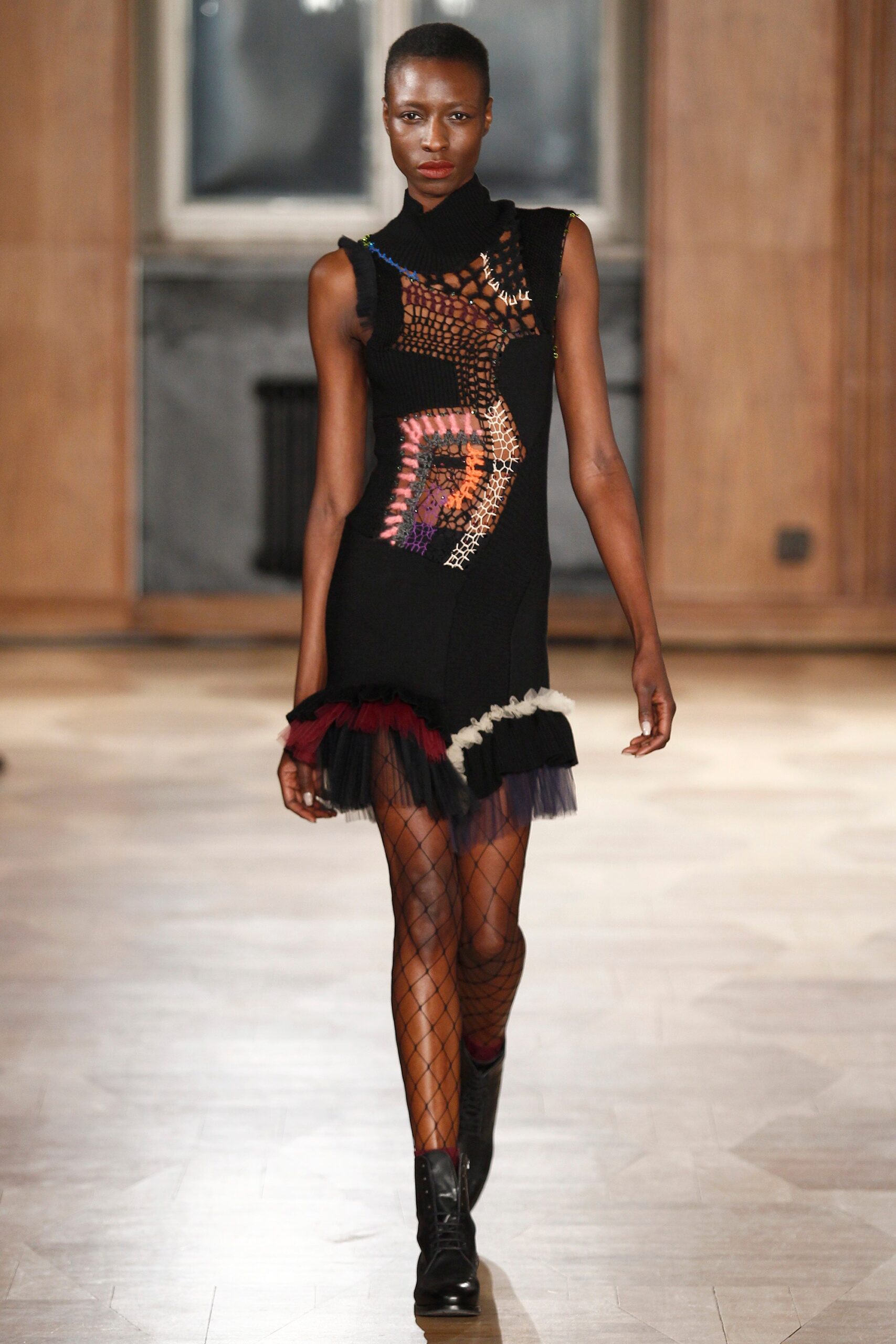 black mini dress with layered details