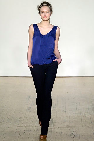 blue silk sleeveless top and black slim pants
