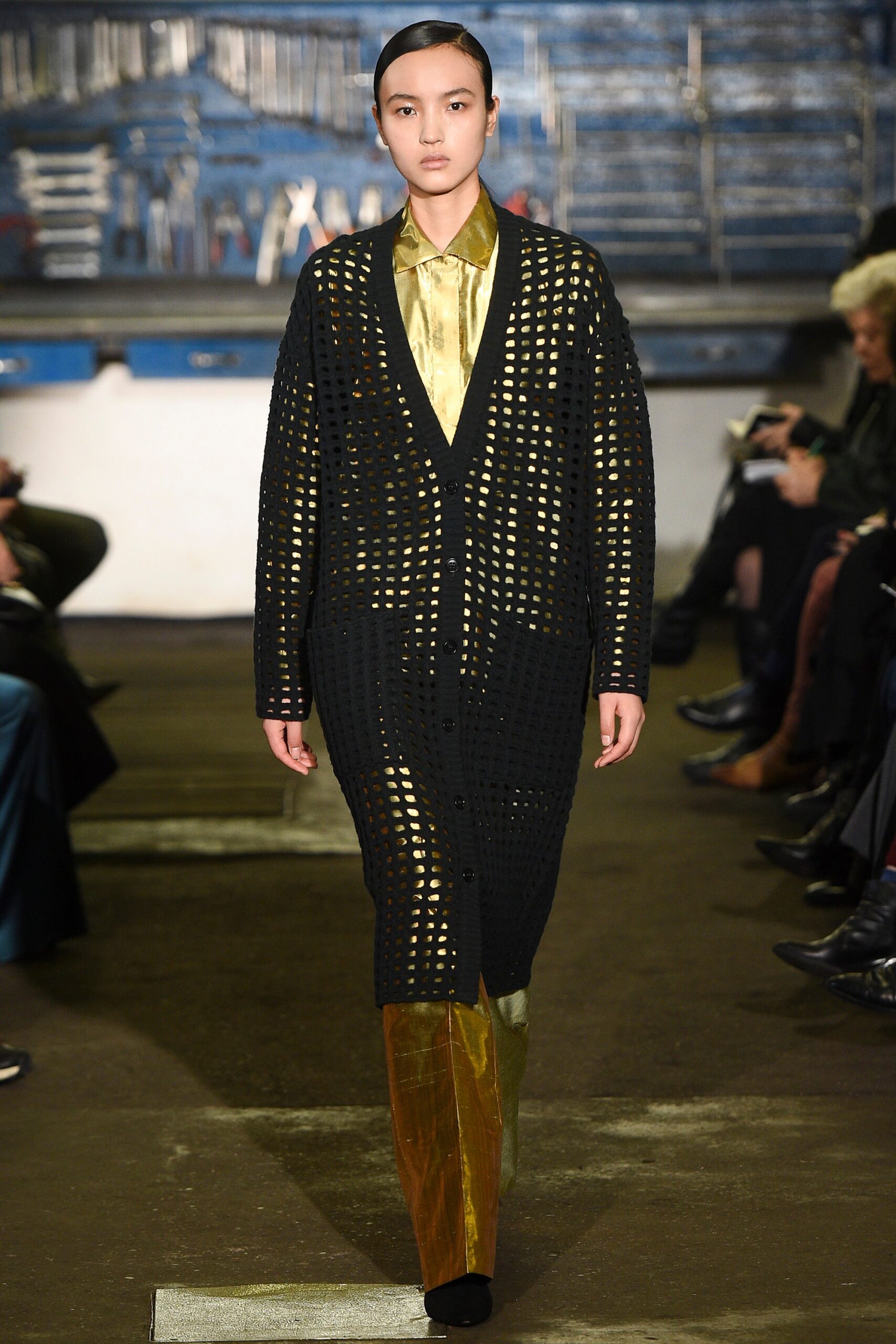 black cardigan gold shirt pants