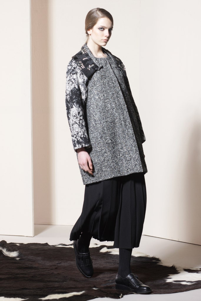 gray wool coat with pleated black skirt