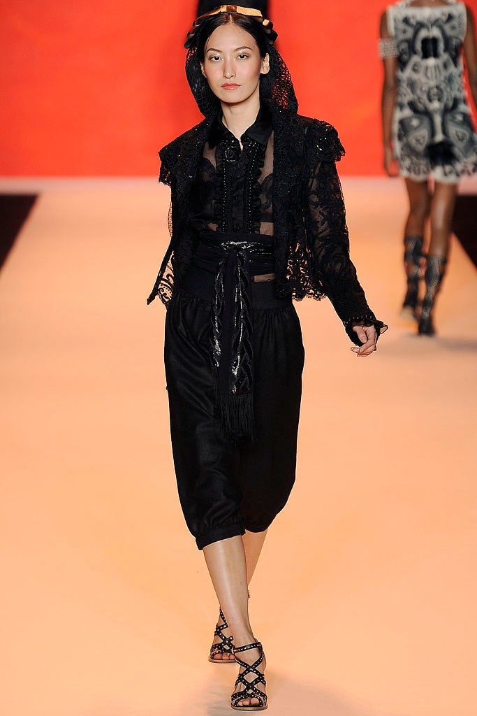 black lace blouse and relaxed pants