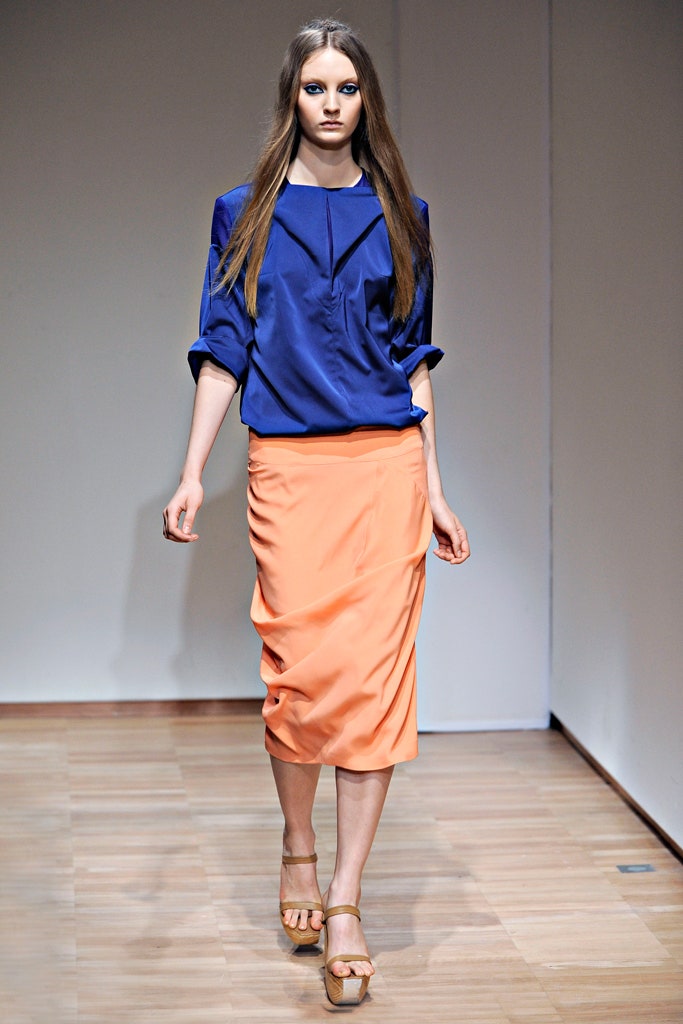 blue fitted top with orange skirt