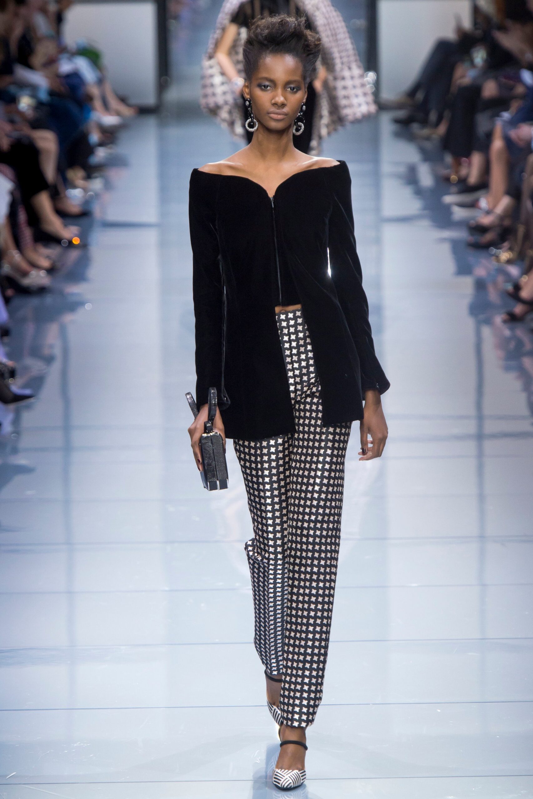 black velvet off-shoulder jacket with checked pants