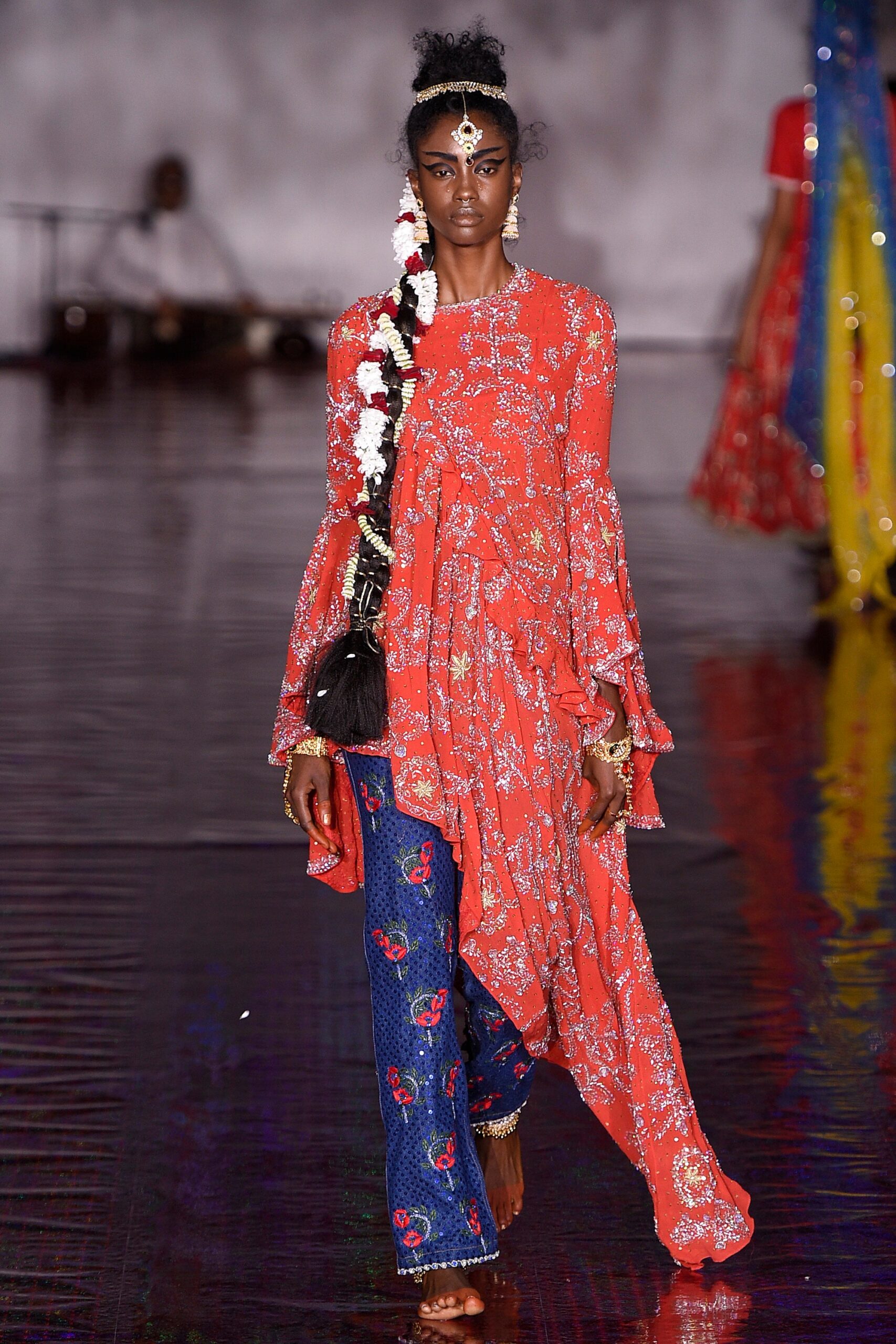 red embroidered midi dress with blue jeans