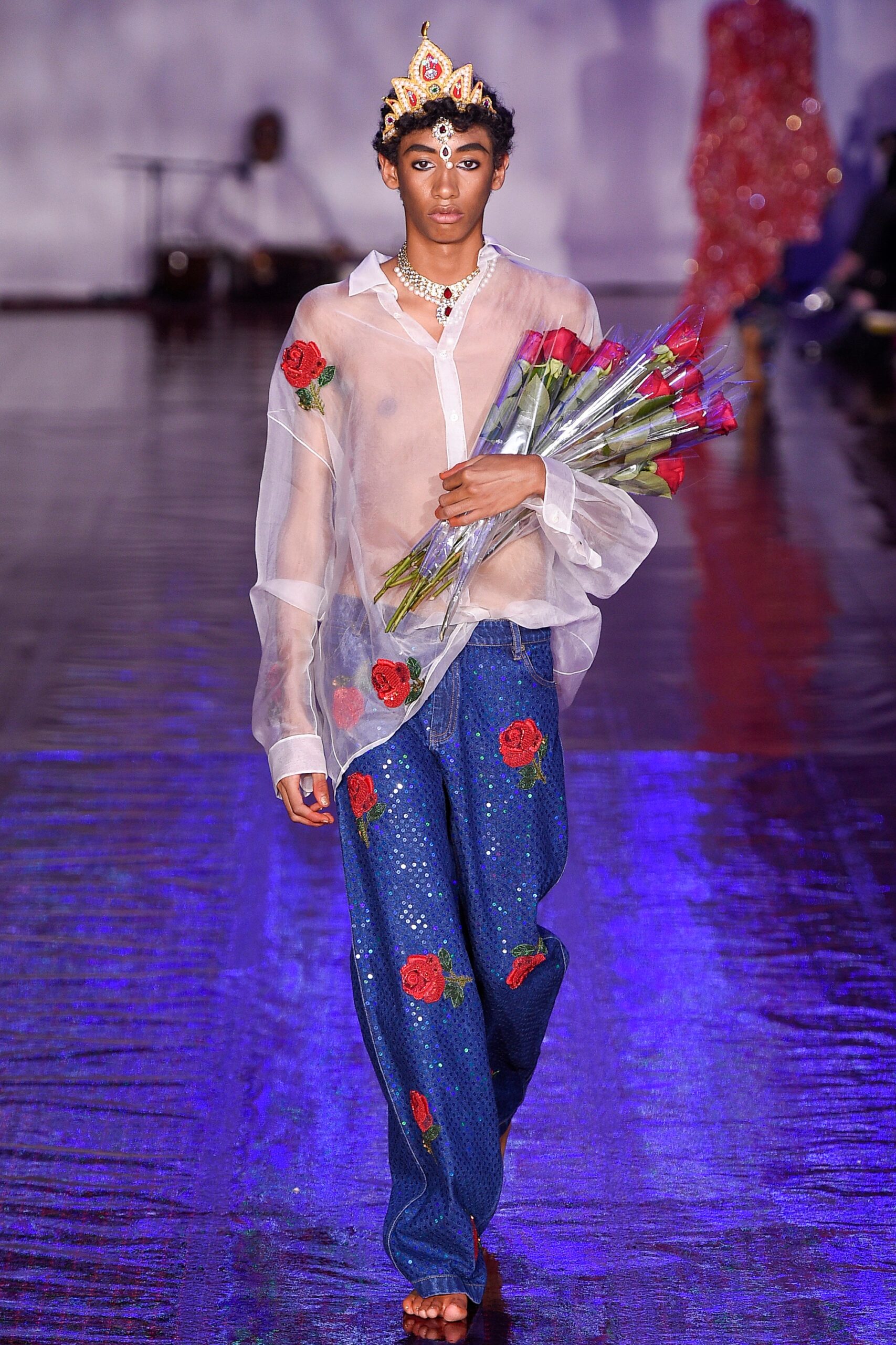 white sheer shirt with blue sequin pants