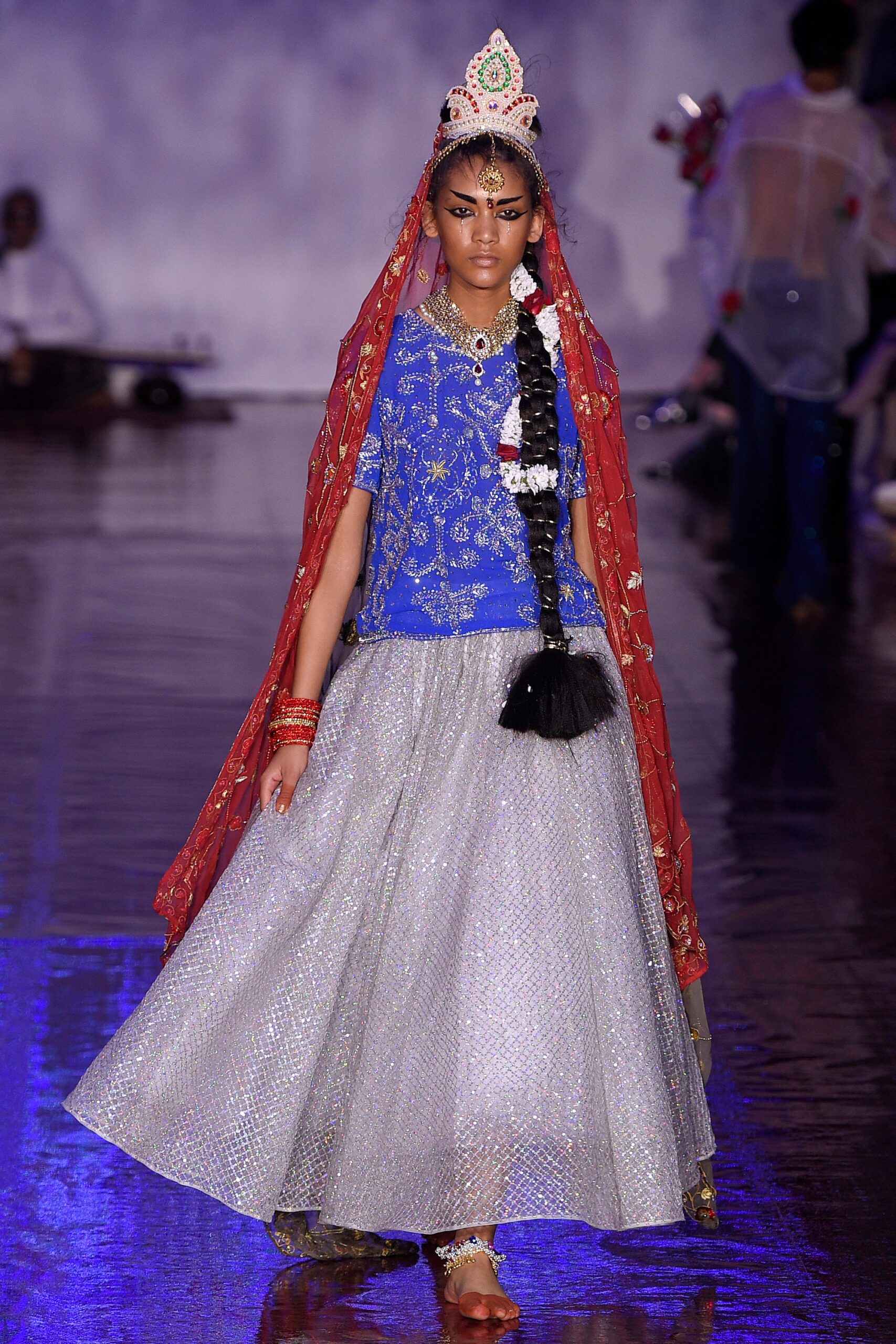 blue silk top with silver skirt