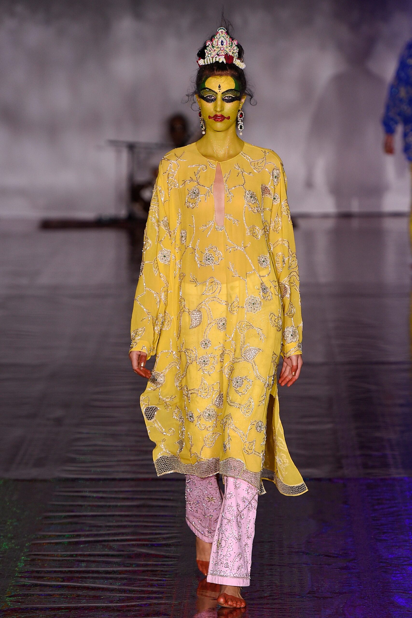 yellow embroidered silk top and white pants