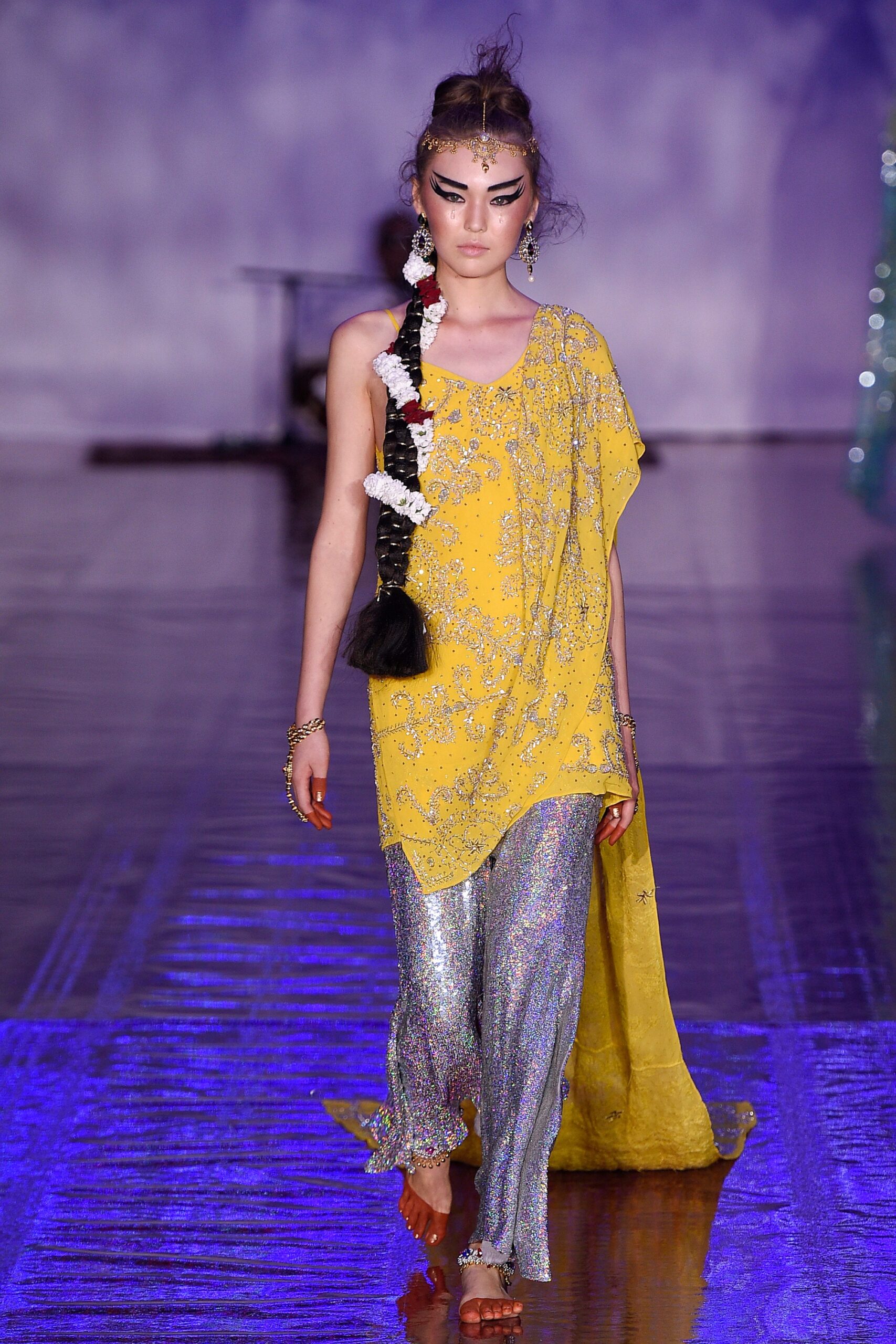 yellow embroidered top with flared pants