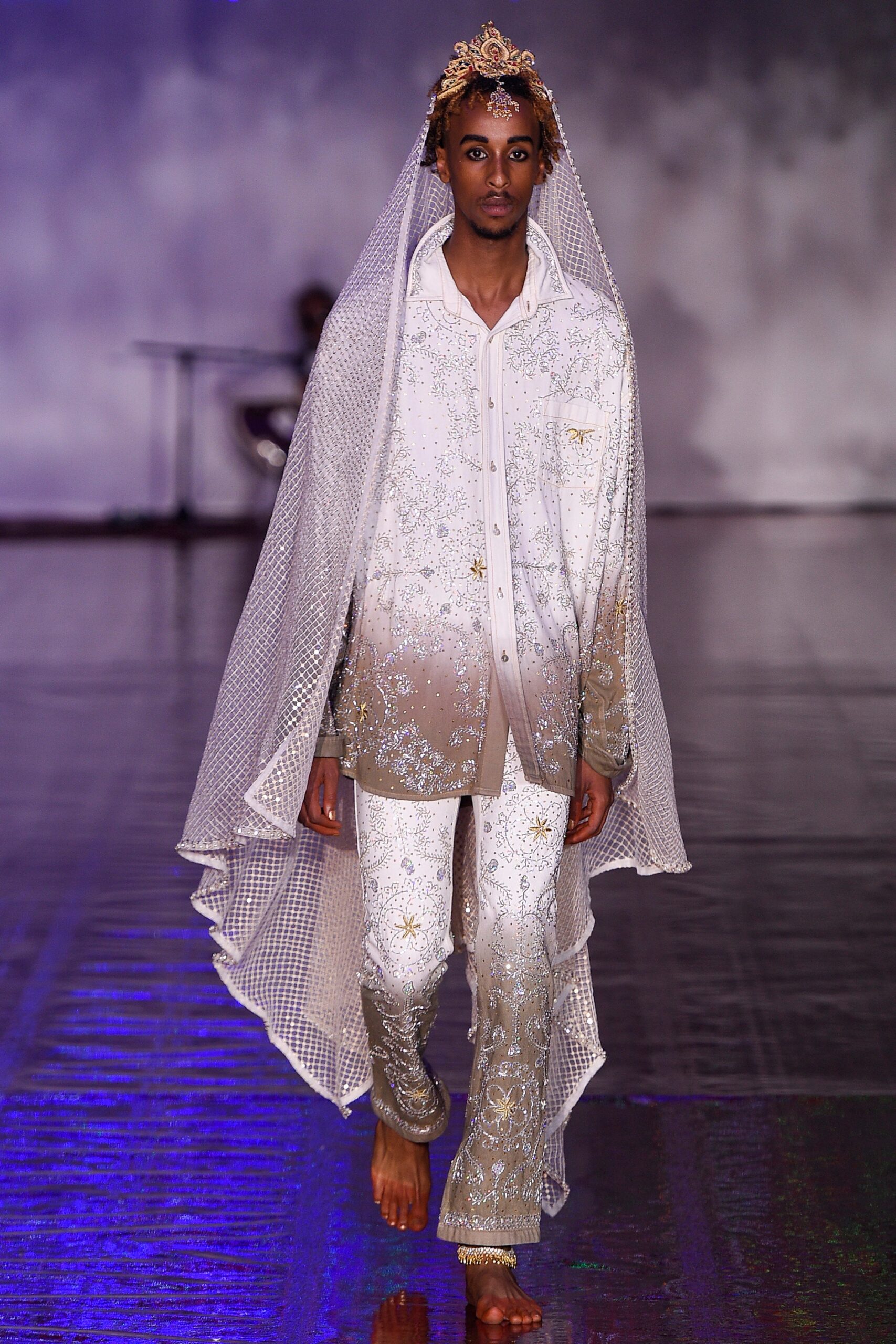 white embroidered silk shirt and pants with sheer cape