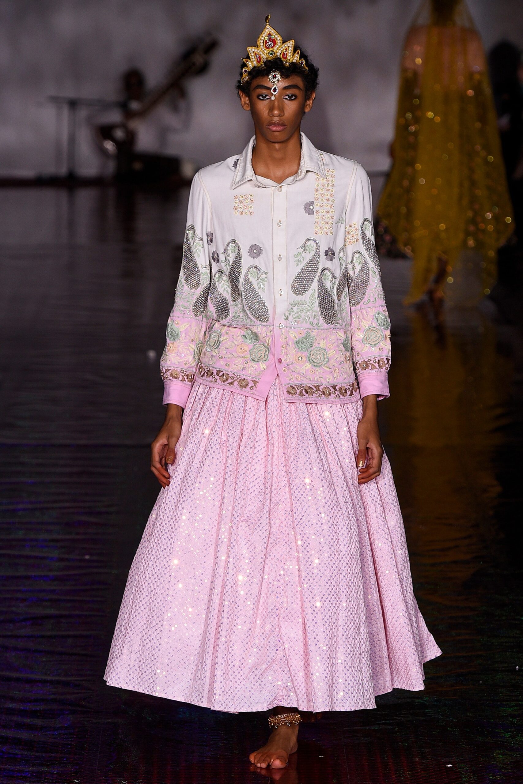 white embroidered blouse and pink sequined skirt