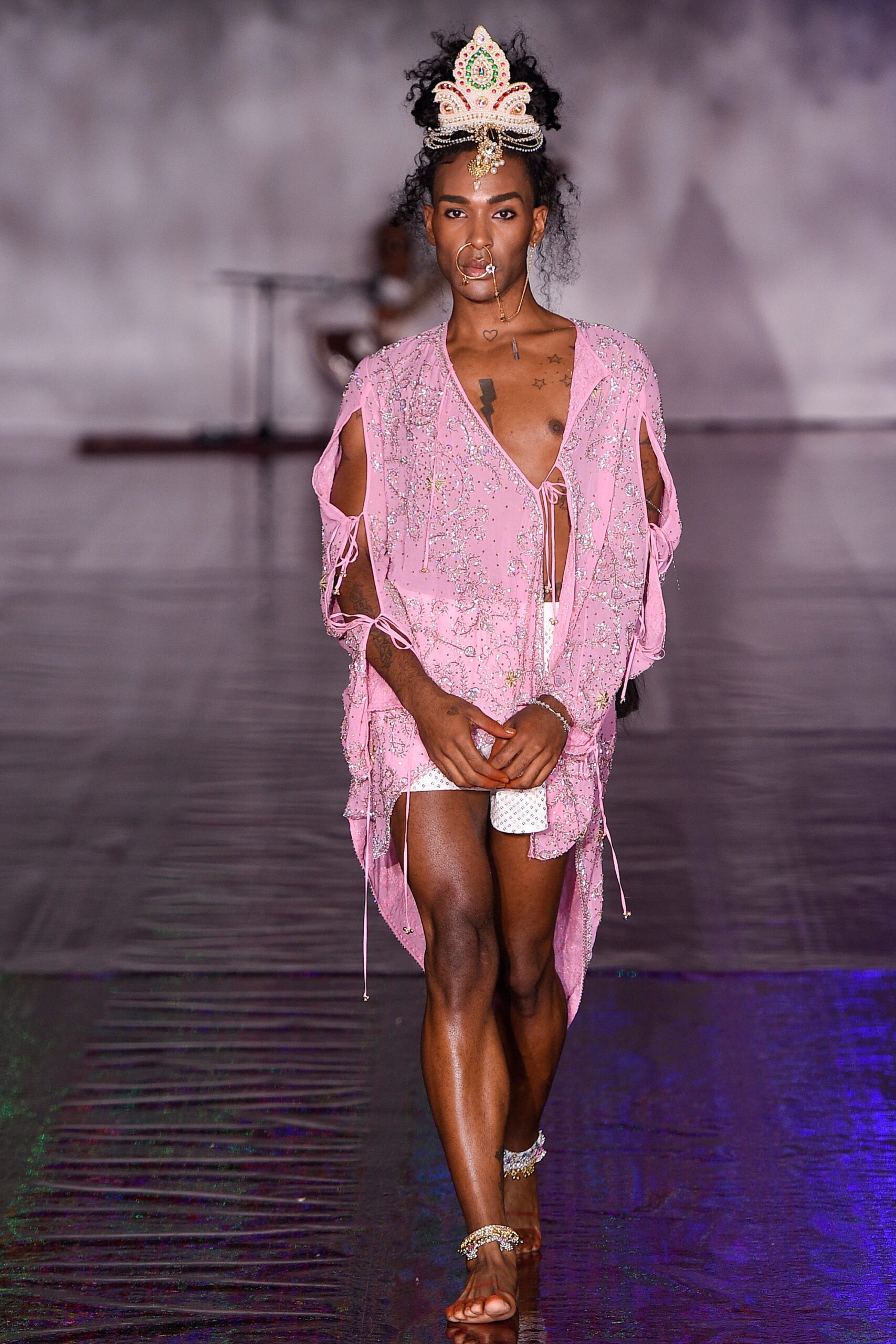 pink embroidered top with white shorts