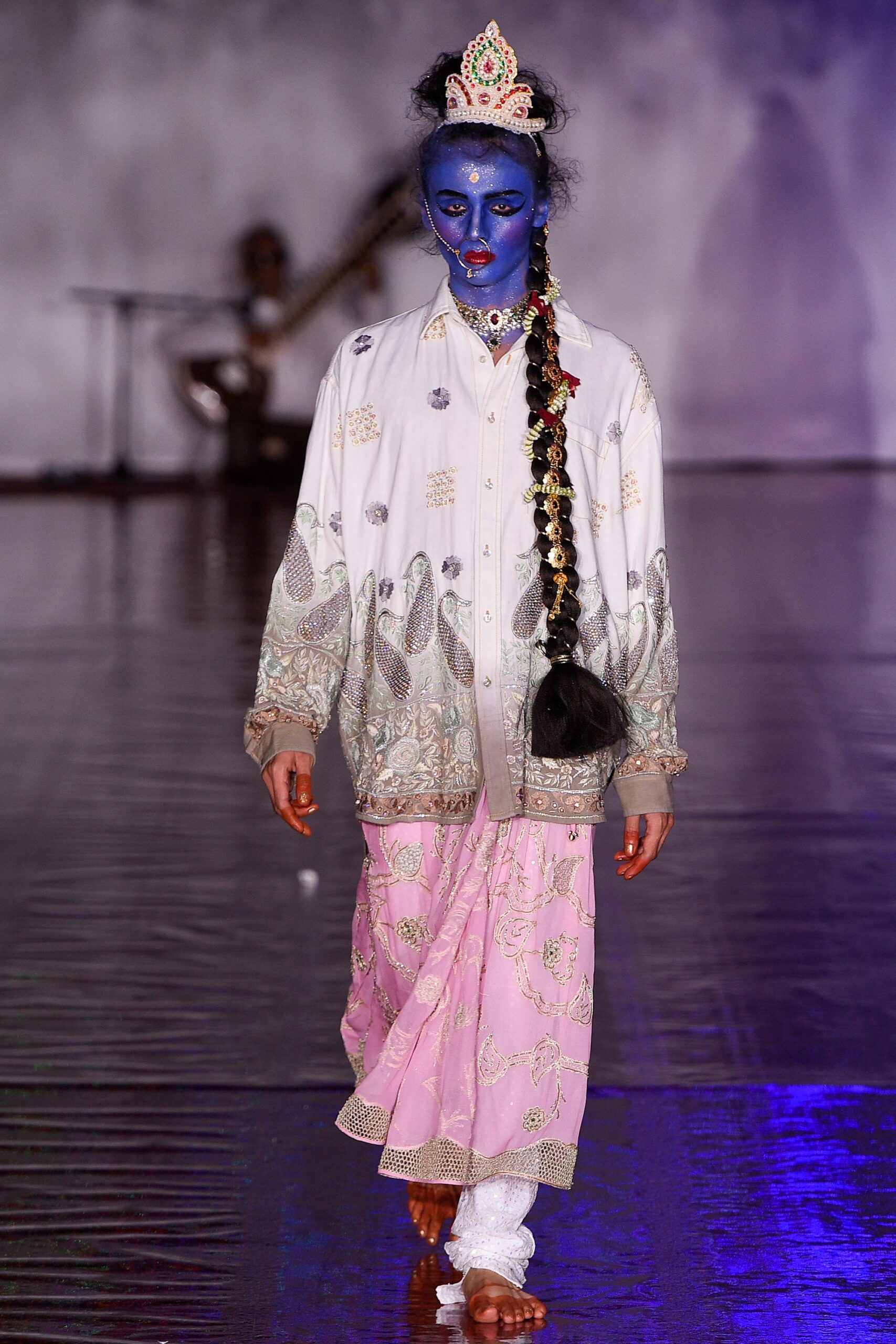 embroidered white jacket and pink skirt