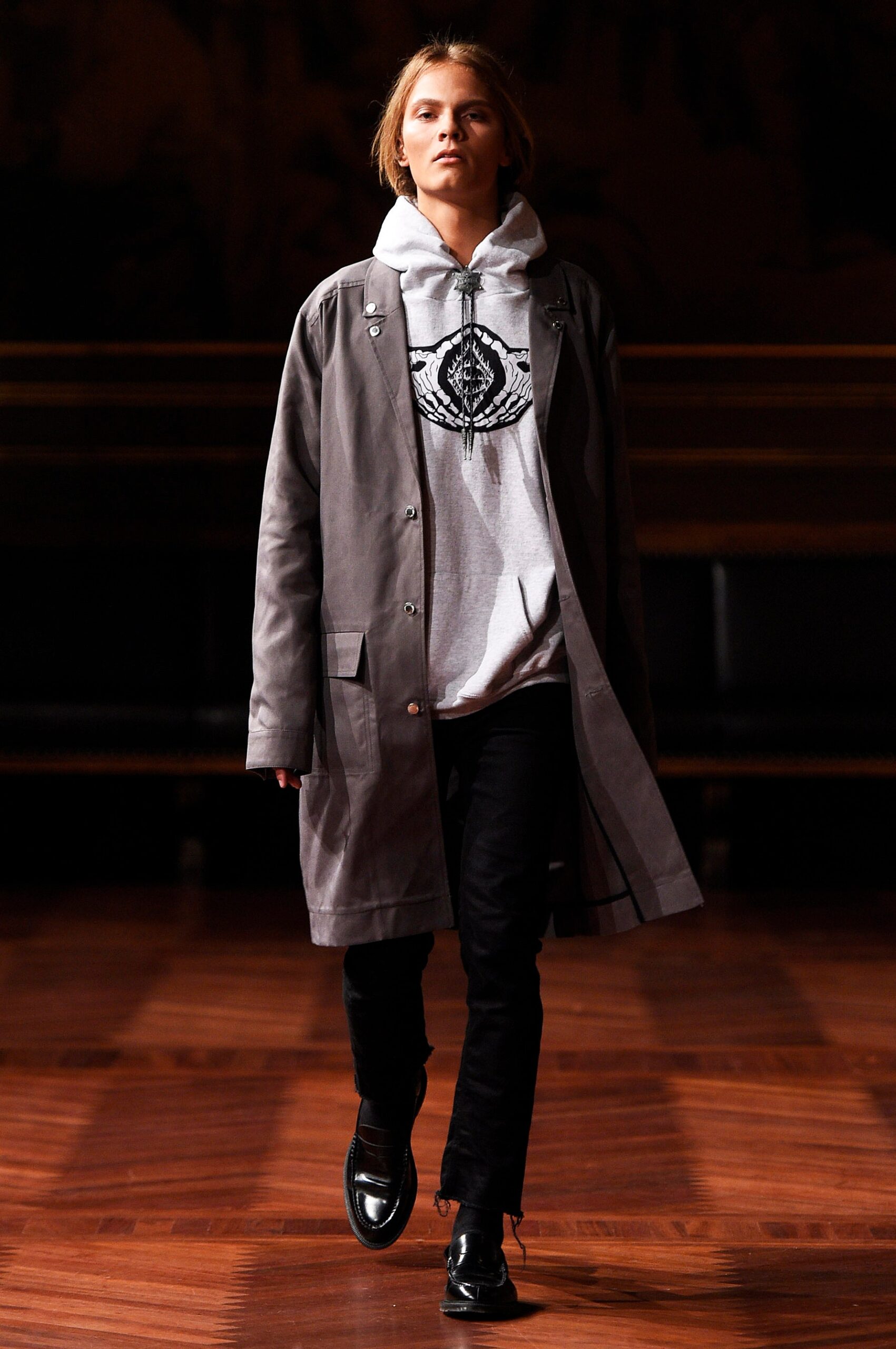 gray coat with hoodie and black pants