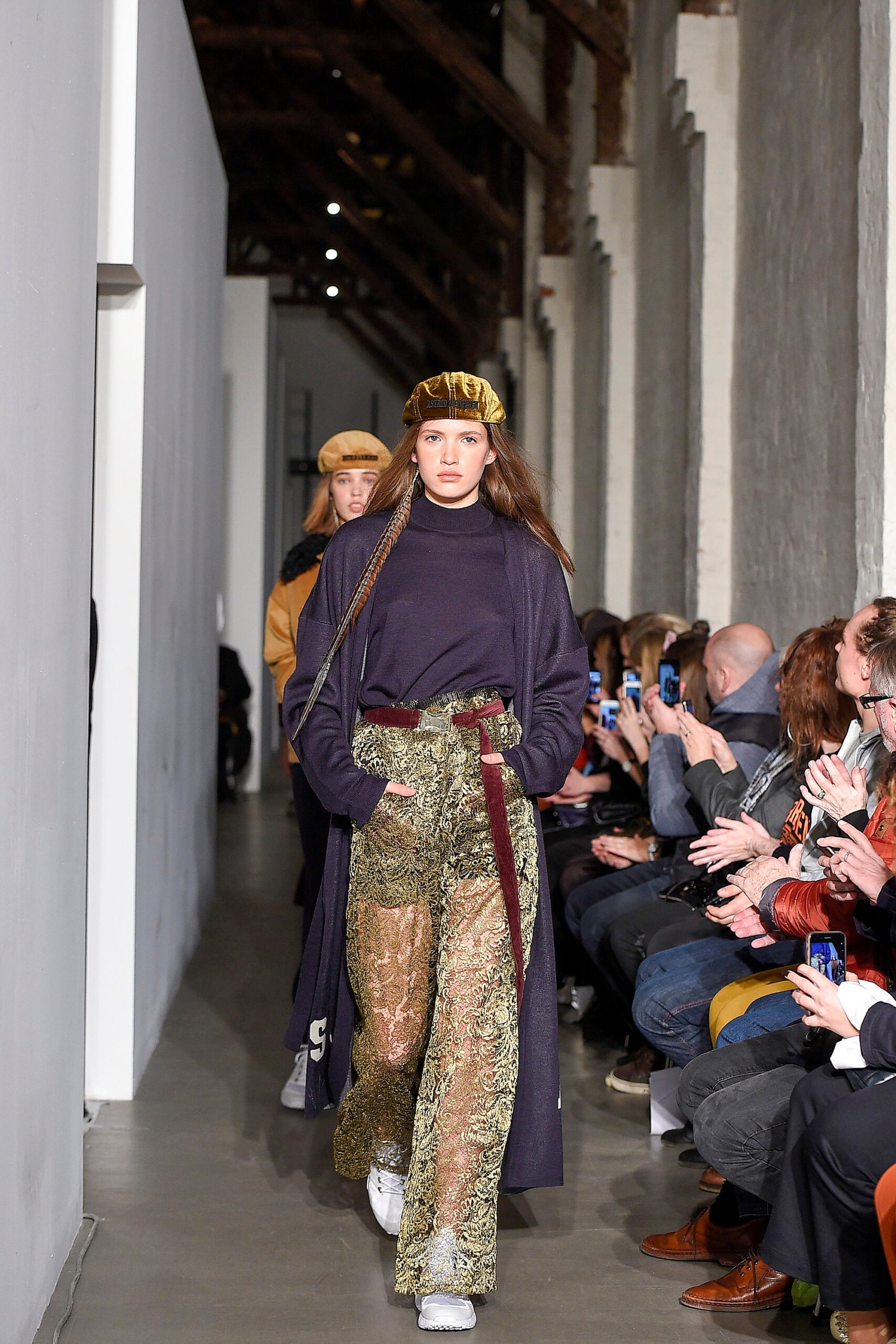 navy top with green flared pants