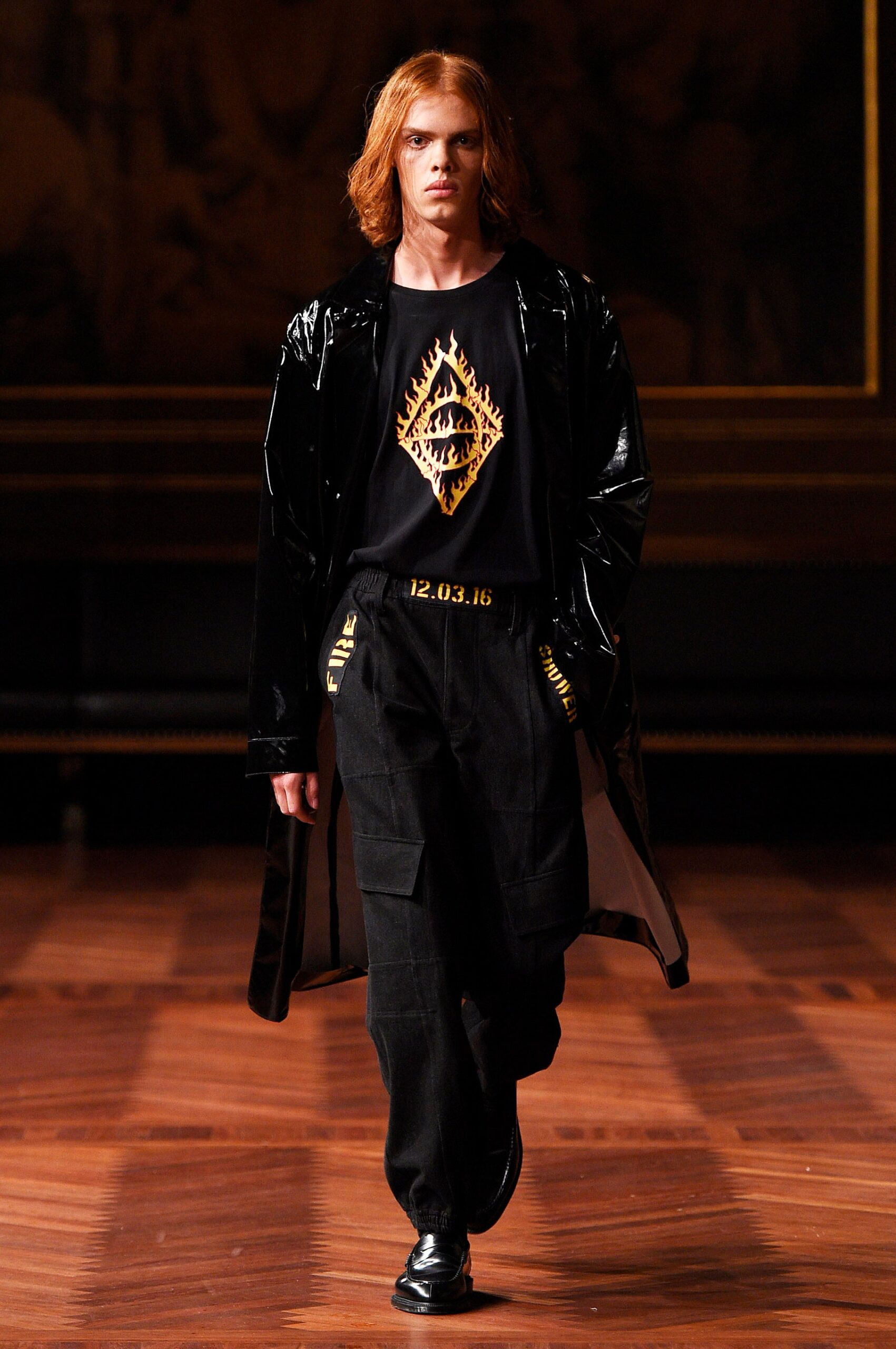 black vinyl coat with t-shirt and cargo pants