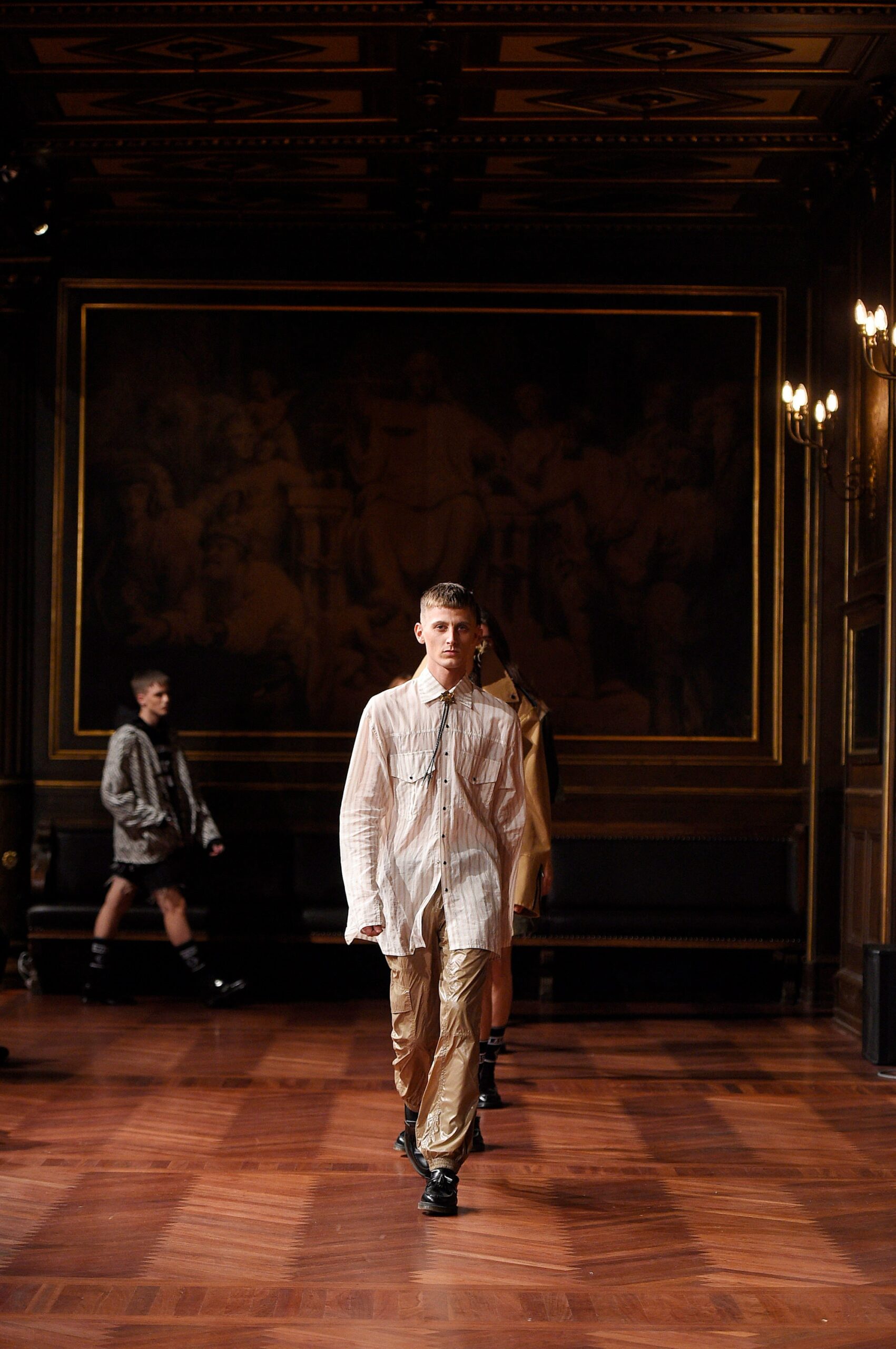 white relaxed shirt with gold pants
